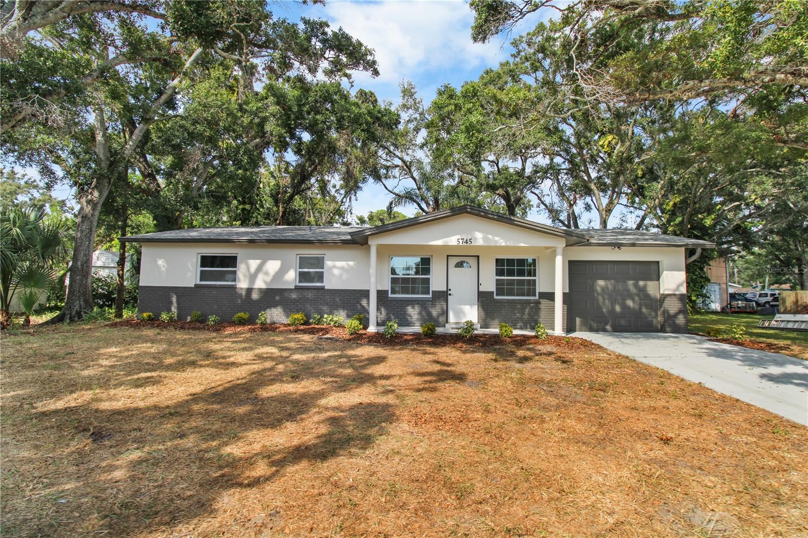 Welcome to your fully renovated, move-in ready 4-bedroom, 2-bathroom home — where modern comfort meets everyday convenience. Step inside and you’ll immediately notice the luxury vinyl plank flooring that flows seamlessly throughout the home, offering both durability and style.

The brand-new kitchen features beautiful custom cabinets, sleek countertops, and updated fixtures — a perfect space to cook, entertain, and gather with family and friends. Both bathrooms feature new modern finishes, creating a clean and contemporary look throughout.

Enjoy cozy evenings by the beautiful fireplace in your living room, adding warmth and character to your home.

Step outside to a large, fenced-in backyard — perfect for outdoor gatherings, barbecues, or giving pets room to run and play. The property also includes a one-car garage and private driveway, offering convenient parking and additional storage space.

Located in a prime area close to local coffee shops, restaurants, shopping, and schools, this home offers the perfect blend of comfort and convenience. Whether you’re a growing family or a first-time buyer, you’ll love the attention to detail and move-in ready condition.

Don’t wait — homes like this don’t last long! Schedule your private showing today and see why this beautiful renovation is the perfect place to call home.