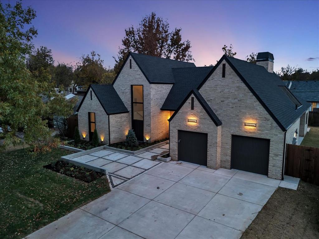 Step into an exquisite new build in the heart of Nichols Hills, where elegance meets modern design. This home is flooded with natural light through expansive glass windows, showcasing a stunning pivoted front door and a seamless indoor-outdoor flow. Imagine evenings spent in your luxurious kitchen and living room, with a glass wall that opens directly to the backyard, revealing a beautiful pool view.On the first floor, the primary suite is a true retreat, featuring a spa-like bathroom and a walk-in closet, along with a convenient washer and dryer. You’ll also find two additional bedrooms and a full bath on this level. Upstairs, there’s a spacious second living area, two more bedrooms each with ensuite baths, a second washer and dryer, and a generously sized walk-in attic for all your storage needs.This home effortlessly combines luxury and functionality, offering a truly refined living experience.