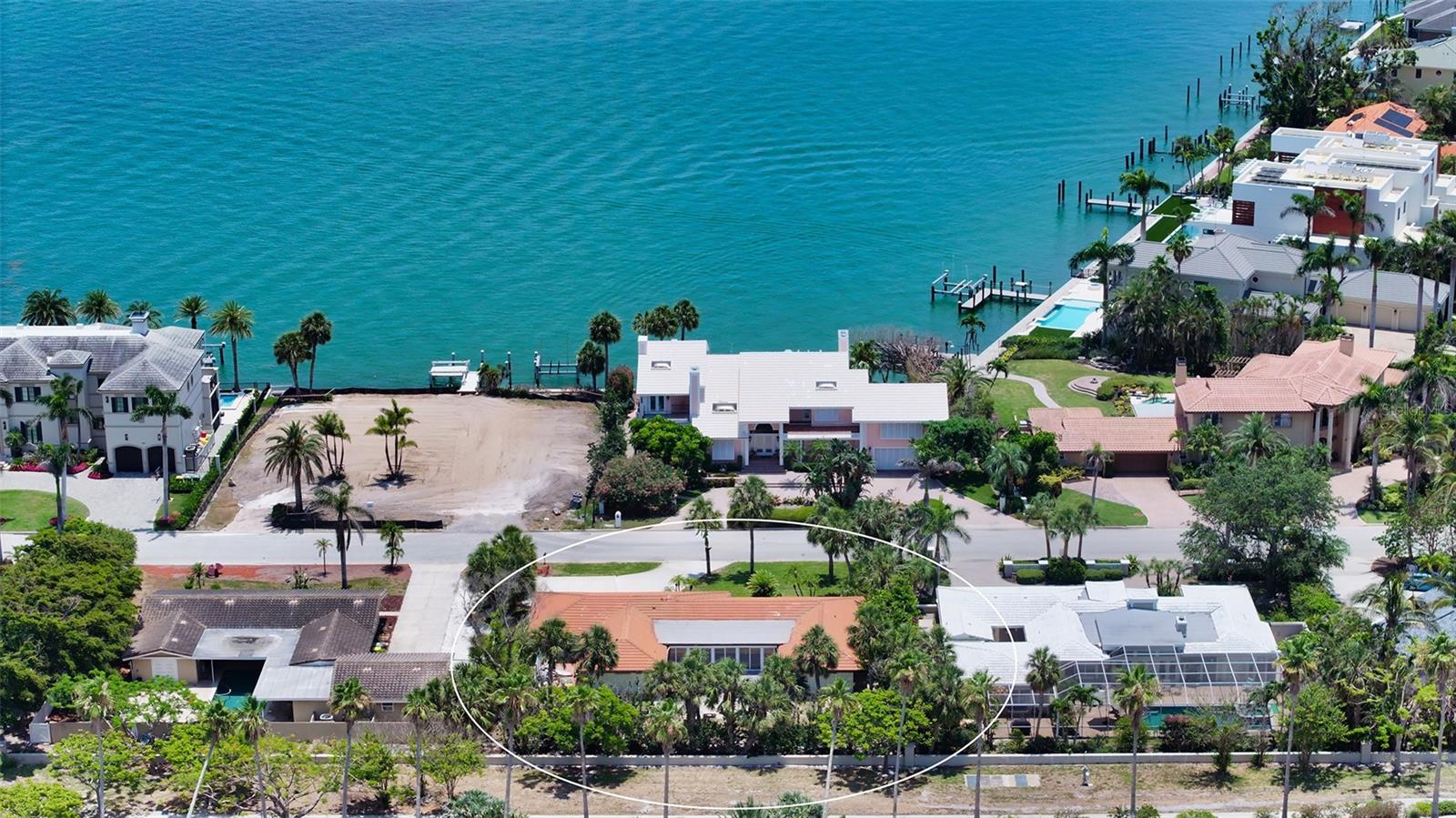 Endless possibilities on Bird Key! This prime garden home sits in a location full of potential. Whether you’re looking to renovate and make it your own, start fresh with new construction, or add space to support your lifestyle—this property delivers. The lot is ideal for building a custom home that takes full advantage of the scenery and views. Already have a main residence? This could be the perfect spot for a guest house, studio, or even a car collector’s garage with room for your growing collection. The Bird Key location is convenient and has easy access to so many shops and galleries. Beach access for the beachgoers is enjoyable on Lido Key, which offers beautiful beaches and recreational activities, St Armands for upscale shopping and dining, Also , the Longboat Key Club is a very short distance away, which offers golf and tennis plus several restaurants. Waterfront living is at its best living on Bird Key, which also has a marina and clubhouse.