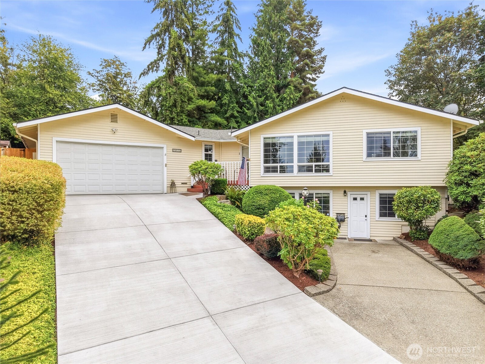 Unique opportunity to live in desirable Rolling Hills neighborhood.  Beautifully updated 4-bedroom,  3 bathroom (one full and two 3-piece baths) home on a spacious .27-acre cul-de-sac lot! This versatile home features 1 full bath, 2 three-quarter baths, and an extra-deep attached 2-car garage with high ceilings. Enjoy a fully fenced backyard with mature landscaping, terraced gardens, and a large patio perfect for entertaining. A second lower driveway provides additional parking and leads to a private entrance with extra office space for added flexibility. Neighborhood includes a community pool and playground.  Centrally located near Kenworth Renton campus, Boeing, Valley Hospital and Blue Origin.  Recent updates include professional exterior paint (2023), interior paint (2024), and a new driveway poured in 2025. Space, privacy, flexibility, and a great location in this move-in ready home.