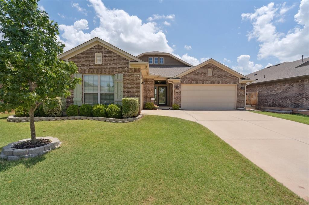 The Perfect home!!   Located on a greenbelt lot in Valencia this beautiful home is the one you have been waiting for.  Step inside and you are welcomed by a spacious foyer with gorgeous wood floors that continue through the great room.  The great room offers a majestic fireplace and floor to ceiling windows that fill the space with natural light and is open to the amazing kitchen that features a large island, granite counter tops, tile backsplash, custom cabinets, stainless steel appliances, walk in pantry, and a large dining area.   The primary suite and spa like bathroom offer the perfect get away from a long day.   The other 3 bedrooms share a full bath.  One of the bedrooms has a private entrance to the primary suite – perfect for a sitting room, office, or nursery.  A built-in desk space is the perfect place for homework, workspace, or charge zone.  The laundry room & mudroom are conveniently located at the garage entrance.  Out back is a covered patio overlooking the greenbelt.  This is spot—sit – relax- you are home.