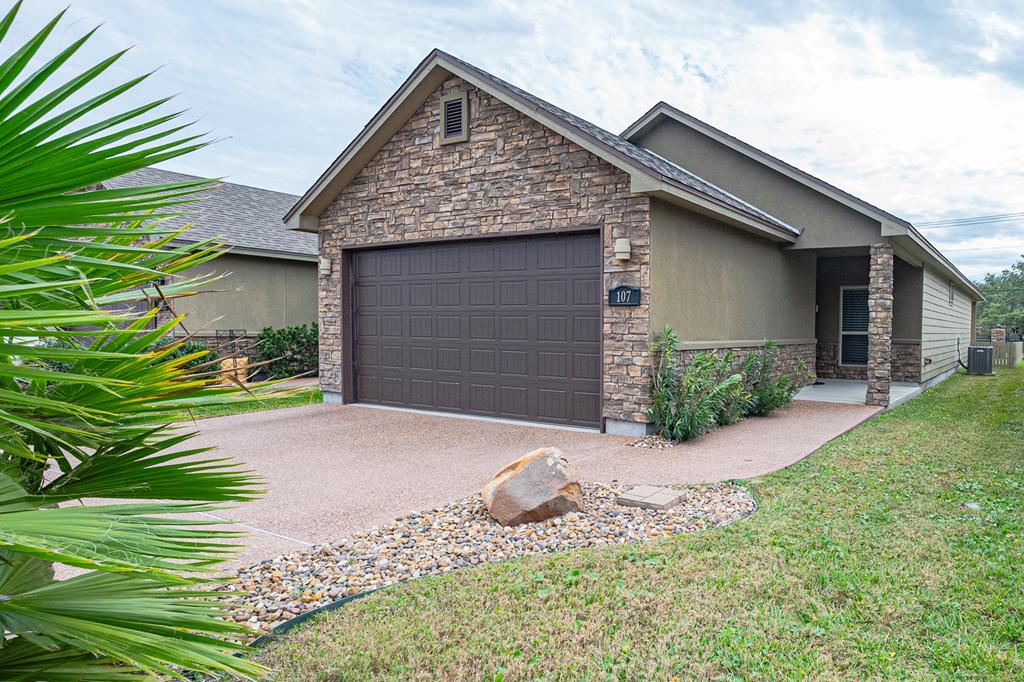 Relaxing Elegance in this single-story home only blocks from the water. Offering top of the line features and custom finishes. Every detail has been taken into account in this coastal dream residence of 1,291 sqft. From the open floor plan to the backyard overlooking the water where you can entertain your friends and family. This private gated neighborhood backs to a lovely stream that feeds into the canal you can enjoy the water views from your back porch. The large owner's suite features vaulted ceilings, ensuite private bath w/granite double vanity, glass shower doors and walk in closet. The kitchen showcases an oversized granite island, granite counters, stainless appliances, and ample storage.  The dining/living area has large windows that let you soak in the waters view.  Just a short walk to dining and shopping centers. You can enjoy watching the waterbirds from inside or on you back covered porch.  Ready to enjoy!