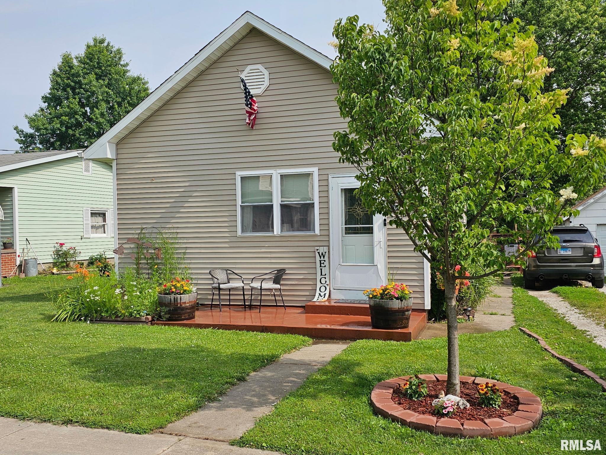 Adorable and cozy 2-bedroom home that is much bigger than it looks! This well-maintained property offers an open floor plan and a warm, inviting feel throughout. Updates include windows, water heater, kitchen and laundry room backsplash, flooring in the bathroom and one bedroom, storm door, updated lighting, and a built-in electric fireplace. Major improvements include the main water line replaced from the house to the street plus a battery back-up sump pump with underground gutter system, providing added peace of mind. The large, floored attic provides excellent storage space. Enjoy outdoor living on the deck and the convenience of a 1-car garage. Located close to the school. A truly charming home that you must see to appreciate! Subject to seller securing specific housing.