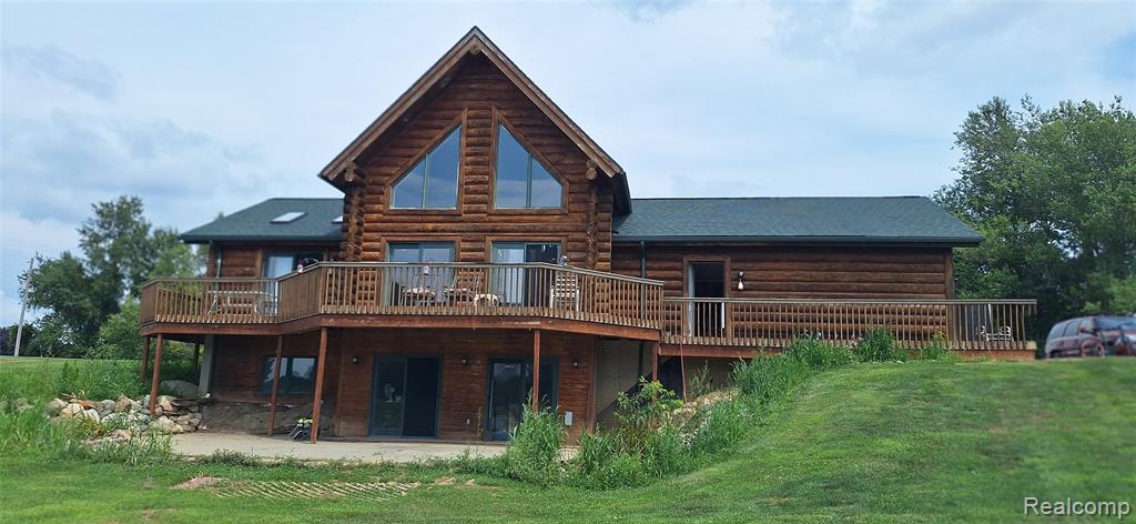 Hunter / Fisherman's delight! Hunt and Fish on You Own Land. Lake / oversized Pond is fully stocked. Deer, Turkey it's all here. This is a totally unique property on more than 60 acres with a portion being leased for farming has an additional Income. A true log cabin home that walk-out lower lever leads right to the waters edge. The large barn is great for storage. Property has been a farm / grow site currently beans rotates to corn. Be your own Farmer, teach them how to Fish, Hunt and care for the Land. You want to feel your far from it all yet your close to everything you need. This property and so much more... this is a total must-see close to M15 for easy accessibility but the beauty of land land land.