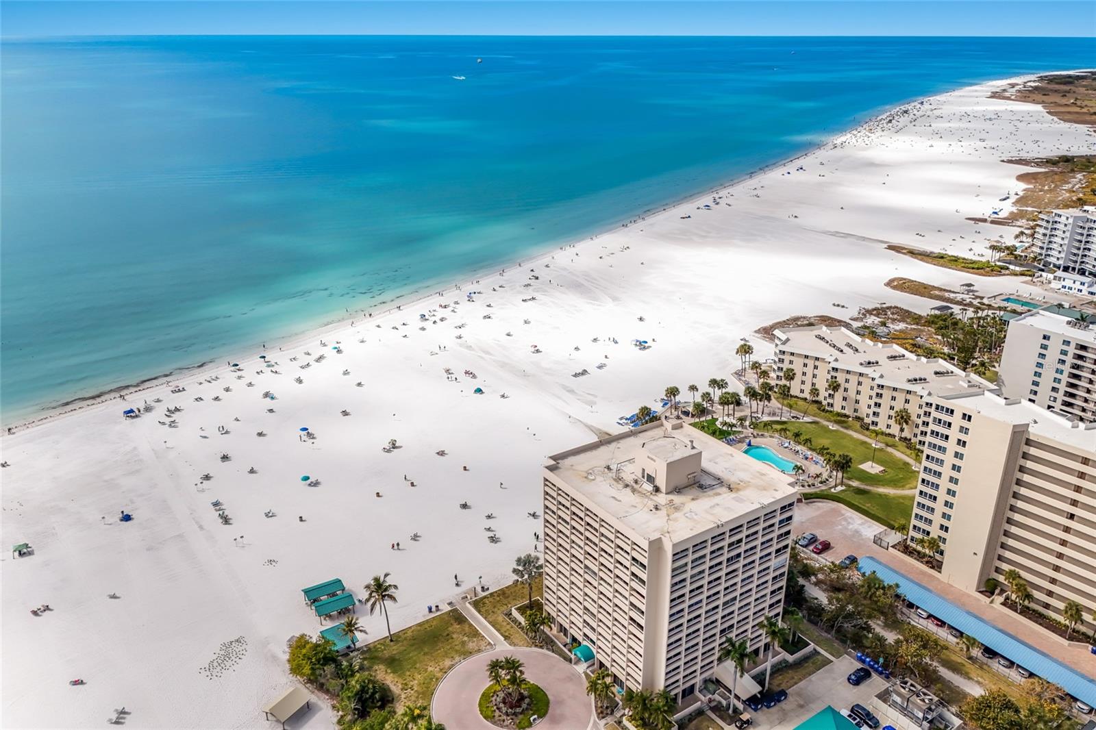 Looking for the perfect 2-bedroom, 2-bath investment beach condo on Siesta Key? This second-level residence presents a strong income-producing opportunity at the desirable, gulf-front Palm Bay Club. Ideally situated on the beach side of Midnight Pass Road, unit #158 features a comfortable coastal design with an open floor plan, beachy ambiance, and tile flooring throughout, making it move-in ready for owners, guests, and short-term renters alike. Just steps from the pristine blue waters and powder-white sands of Siesta Beach, the thoughtfully designed and tastefully furnished interior maximizes space and functionality with seamless flow from the kitchen to dining and living areas. One of the premier beach-to-bay communities on Siesta Key, Palm Bay Club offers an exceptional array of amenities including two heated swimming pools, a hot tub overlooking the bay, fitness center, lighted tennis court with two pickleball courts, BBQ grills, a fishing pier, and boat docks available for daily rental. With a rare three-night minimum rental policy on Siesta Key and onsite management, this is an outstanding opportunity for the savvy owner-investor seeking both lifestyle and income.