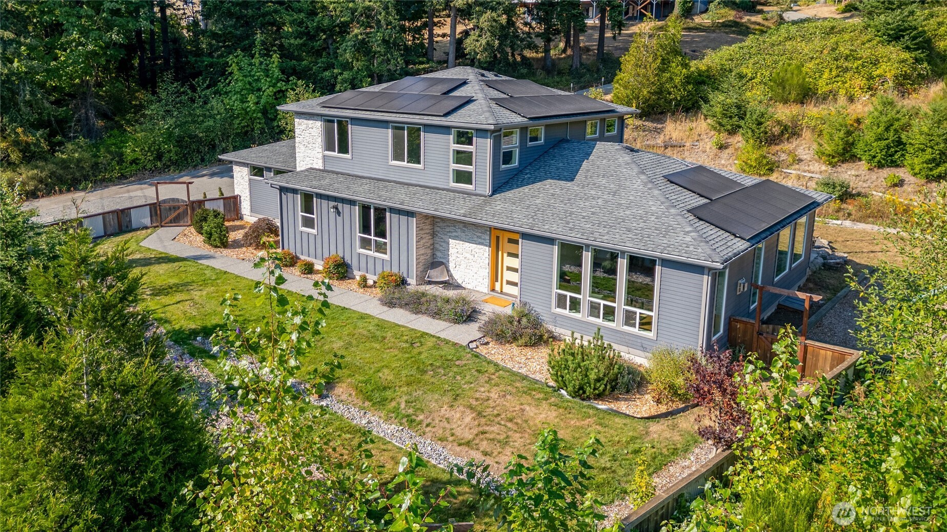 Welcome home to this stunning 3 bedroom, 2.5 bath home, built in 2019 with comfort and versatility in mind! The main-floor primary suite offers convenient single-level living and features a spa-like primary bathroom and a beautifully organized walk-in closet with a custom California Closets system. A versatile bonus office/den provides the perfect space for working from home or a potential fourth bedroom. The spacious, open layout is ideal for entertaining, with a cozy gas fireplace and a gorgeous kitchen featuring quartz countertops and stainless steel appliances. A large walk-in pantry adds exceptional functionality with its own sink, custom cabinetry, second fridge and quartz counters. Step outside to the huge custom patio with a built-in fire pit, an incredible space for entertaining, relaxing and enjoying evenings outdoors. Upstairs, an expansive loft provides even more room to spread out, perfect for a second living area, media room, playroom or home gym. Air conditioning keeps things comfortable year-round, while the solar system helps offset energy costs. An oversized 2-car garage provides plenty of room for vehicles, storage and gear. All this in a fantastic location moments away from Fairhaven, shopping and just steps from 100 Acre Woods, Arroyo Nature Preserve, the Interurban Trail and so much more!