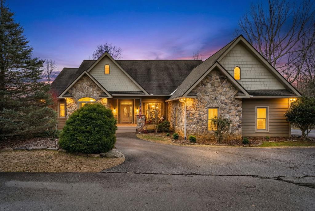 Escape the ordinary in this 3-bed, 3-bath home on 2.4 acres.  Vaulted tongue & groove ceilings and rich wood floors bring warmth and character throughout. Enjoy fireside evenings, a dedicated dining room, and a primary suite with double vanities. The walkout basement offers a family room, full bath, and flex space for guests or hobbies. Upper and lower decks overlook peaceful wooded surroundings, while a paved driveway, attached 2-car garage, laundry room, and fiber-optic internet make life easy. Homeowners can enjoy living in a gated private community and benefit from having access to a common pavilion with an outdoor fireplace, ideal for hosting friends. Whether you're working from home or hosting a weekend crowd, this home delivers the space, charm, and comfort to do it all.