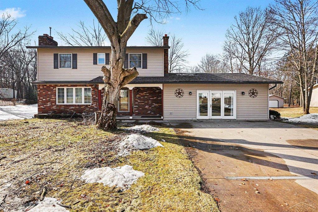 Country living with room to roam! If you are ready to leave the city and enjoy a quieter rural setting, this property offers the space and comfort you want. This 2000 square foot, 2-story home offers 5 bedrooms, 2 full baths, a walkout basement, and a massive pole barn. The kitchen features oak cabinetry, Corian countertops, newer appliances, and a generous center island. The open layout connects the kitchen, dining area, and a cozy living room with a brick wall fireplace. One full bath features a Jacuzzi tub, and the other a large shower. In the basement you'll find even more living space with a bar, second fireplace, and a sliding door that leads to a patio, creating an inviting spot for entertaining. The metal shingle roof includes a lifetime warranty. Outdoors, the property stands out with impressive 40x85' heated pole barn with storage for boats, vehicles, or extra workspace. It even includes its own half bath. An additional 20x20' outbuilding increases storage options as well. Located on 14 acres right next to Crooked Lake, this property offers the best of nature, hunting and lake life. Schedule your tour today!