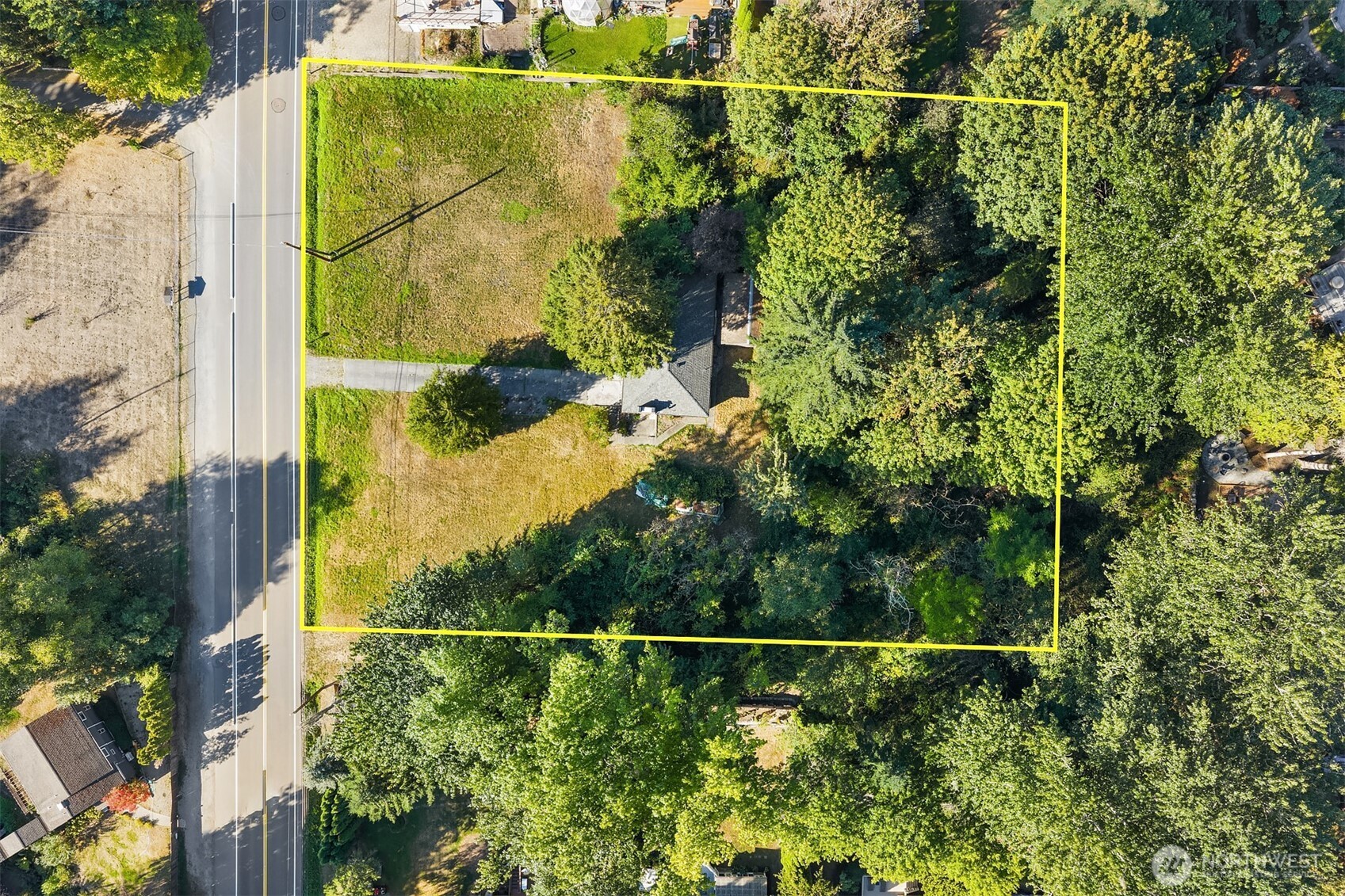 Investor Alert – Exceptional Development Opportunity in Lake Forest ParkOver 1.5 acres of prime property with excellent street frontage, estimated at 223’ x 300’. Mostly open with a gentle slope, this parcel is ideal for a new development. 9 sewer stubs already on property!    A 2,340 sq ft home currently sits on the property, but the true value lies in the land and its potential.    This is an estate sale—buyer to verify all details, zoning, and development possibilities.