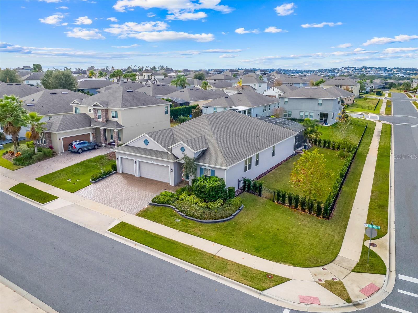 Under contract-accepting backup offers. Welcome to this stunning, upgraded home offering 4 bedrooms, 3 full bathrooms, and over 2,800 square feet of thoughtfully designed living space. High ceilings and an open floorplan create a bright, airy atmosphere, while expansive sliding doors open seamlessly to the lanai, delivering true indoor/outdoor living.This home features not one, but two versatile flex/bonus rooms, ideal for a home office, den, formal dining room, playroom, workout room,  or whatever suits your lifestyle. The primary suite offers a private ensuite bathroom with dual sinks, private water closet, and dual walk-in closets. One of the guest bedrooms also enjoys its own ensuite, offering comfort and privacy for family or visitors.Situated on a a highly desirable, oversized, fully fenced corner lot, the property offers ample parking due to the corner lot location. Elegant, mature landscaping with decorative garden curbing and tasteful uplighting in both the front and back yard makes this home truly stand out.Step outside to your own private oasis featuring a heated, fully screened-in pool with a sun shelf, creating a resort-style retreat perfect for relaxation or entertaining year-round.Custom work and high-end upgrades are found throughout the home, including crown moldings, tray ceilings, extra tall 8-foot doors, custom 42” kitchen cabinets, quartz countertops, custom accent wall in family room, and custom pantry and laundry room. The washer, dryer, and dishwasher were all replaced in 2025, adding peace of mind and modern convenience. This extremely well maintained and exceptional home combines style, functionality, and resort-like living—don’t miss the opportunity to make it yours.Canyons at Highland Ranch offers a large resort-style community pool, splash pad and playgrounds, walking and nature trails, pet stations and dog park, outdoor recreation spaces such as sand volleyball courts, basketball court, and firepit gathering areas. It's close proximity to A-rated schools, shopping, and major commuter routes make it ideal for staying local or easy travels to Orlando theme parks or Downtown Orlando.