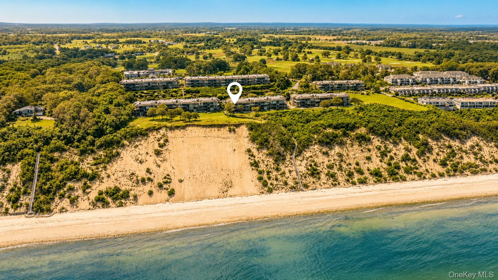 Luxury. Location. Lifestyle. Your North Fork escape starts here.An ultra-rare 2-bedroom, 2-bathroom ground-floor corner residence in one of the North Fork Wine Trail’s most desirable waterfront communities. Enjoy expanded outdoor living space, water views, exceptional proximity to the private beach, and the added privacy of a corner unit in one of the quietest buildings in the community—all while being perfectly positioned to enjoy everything the North Fork has to offer.Enjoy relaxing nights by the fire or listening to records in the chic living room. Immerse yourself in the feel of a luxury hotel in your primary bedroom with a designer-quality ensuite bath complete with spa tub. Work in style or be the ultimate host with a secondary room that is easily convertible between office and guest quarters. Watch TV on the lanai, classic North Fork sunsets from the patio, and the abundance of wildlife in your backyard during cozy fall evenings.The amenities make every day feel like a getaway, with a private beach, swimming pool, tennis courts, pickleball courts, and fitness center right at your fingertips.Offered fully furnished and ready from Day 1 – this is a TRUE TURNKEY retreat equally suited as your full-time North Fork home, vacation escape, or a potential rental opportunity. Thoughtfully designed with an elevated coastal aesthetic and unmistakable North Fork flair, this is more than a home—it’s an opportunity to start living the lifestyle you’ve been waiting for.