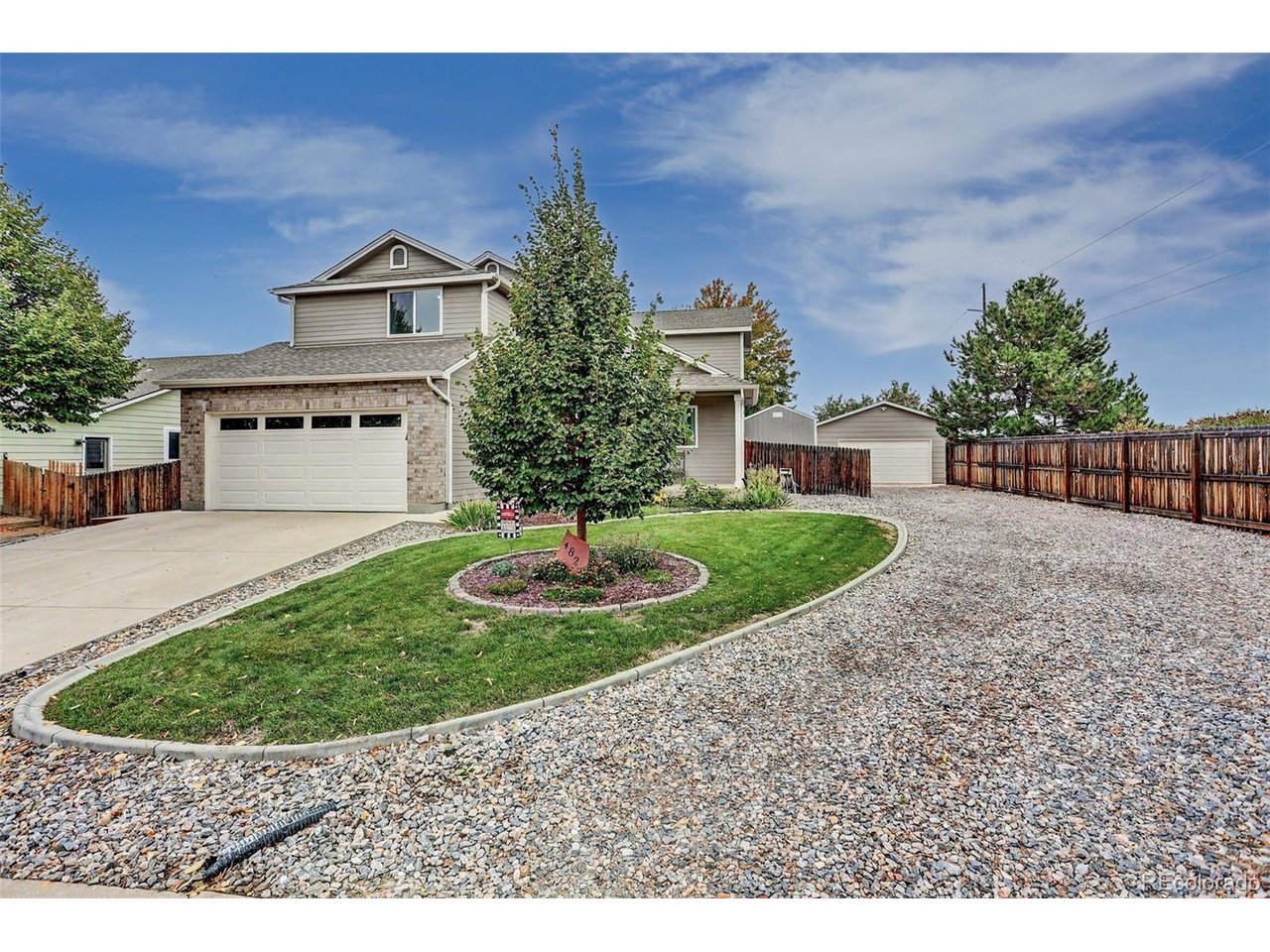 This corner lot beauty shines from every angle, is move in ready, with fantastic curb appeal, that has been meticulously maintained and elegantly appointed by the original owner.  Step inside and be wowed by this move in ready gem! The upgraded kitchen is a showpiece with beautiful cabinetry, stainless appliances, a large bar/island, tons of counter space, and a charming eat-in nook, creating a space that is warm, fun, and functional. The adjoining family room is spacious and features a cozy fireplace.  The main level also highlights a beautiful formal dining w/built in cabinets and a bright professional office/flex/second family room area. Retreat to your oasis at home in the gorgeous primary suite with a luxurious five-piece bath and walk in closet. The bedrooms are big and bright offering room to grow, and the bathrooms have been updated with custom tile, granite, fixtures and floors.  Main level laundry makes everyday living convenient and effortless. The basement is a perfect opportunity for a home gym, game room, flex space, storage, utility area, media room, man cave, workshop, or office.  The fairway style oversized backyard is fully fenced, private and immaculately maintained, welcome to your private park! Sit on the large, no maintenance covered deck with custom adjoining patio, perfect for a hot tub, and drink in the peace and serenity with plenty of space for cooking and entertaining with family and friends.  More upgrades include a magnificent custom detached 30x24 fully finished detached garage with an 8' door, perfect for toys, projects, storage, cars, trucks etc.  New carpet with upgraded pad throughout, newer upgraded windows, a newer furnace and A/C, custom paint and lighting, beautiful tile and hardwood, and convenient storage shed.  All of this in an ideal location, with quick access to shopping, schools, recreation, open space, restaurants, and more, with easy access on I-25 to Denver, Downtown or north to Fort Collins! A must see in this price!