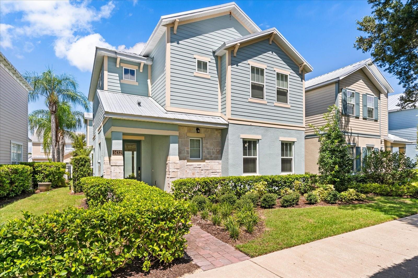 OVER $50,000 PRICE DROP! Stunning Key West Style Home that Blends Modern Luxury with Resort-Style Living! This like NEW 2022 build was designed with exceptional attention to detail. Featuring a fantastic open-concept floor plan, this home is loaded with high-end fixtures and energy-efficient LED lighting throughout. Step into the spacious living area, complete with a decorative electric fireplace and a built-in workspace as an added bonus, perfect for working remotely. The gourmet island kitchen is a chef’s dream, boasting ample cabinet space, quartz countertops, stainless steel appliances, and an additional wet bar sink. The dining area is adjacent to the kitchen and comfortably seats up to 10 guests, making it ideal for family gatherings or dinner parties. The first floor also includes an en suite bedroom with walk-in shower. Additionally there is a half bath adjacent to the dining area that also allows access to the pool area for guests. The garage has been transformed into a fun game room featuring a Pop-A-Shot basketball and other fun games, but can easily be converted back to a traditional garage if desired. Upstairs, you enter double doors to the luxurious primary suite, highlighted by tray ceilings and a spa-inspired bathroom with dual vanities and an expansive dual walk-in shower. The three remaining guest rooms are professionally decorated with theming also feature en-suite bathrooms. A versatile loft space has been converted into a cozy theater room, complete with a projector large screen and elevated seating perfect for movie nights. The laundry room is conveniently located on the second floor and has built-in cabinets as well. Start your mornings off right on the upstairs balcony, overlooking the incredible pool area below. The outdoor living space offers two covered lanais, perfect for summer BBQs and year-round entertaining.  This home is an amazing opportunity for your rental investment property, second home or primary residence.  Reunion Resort is a 2,300 acre Private Golf and Tennis Community, just 6 miles to Disney and the parks, and a 30 min drive to the Orlando International Airport.  Enjoy the Reunion Grande where there are several delicious dining experiences that include a Sushi Bar, The 7593 Chophouse both located on the Lobby Level. Eleven is a rooftop restaurant & bar to enjoy your favorite cocktail, tapas style cuisine or relax by the fireplace and pool. Located adjacent to the hotel, enjoy the Golf Clubhouse, the Seven Eagles Pool Pavilion & fitness center. Additional amenities include 3 Signature Golf Courses, a miniature putt putt course, 5 Acre Waterpark, 12 community pools, playground, sand volleyball, tennis & pickleball courts and dog parks.