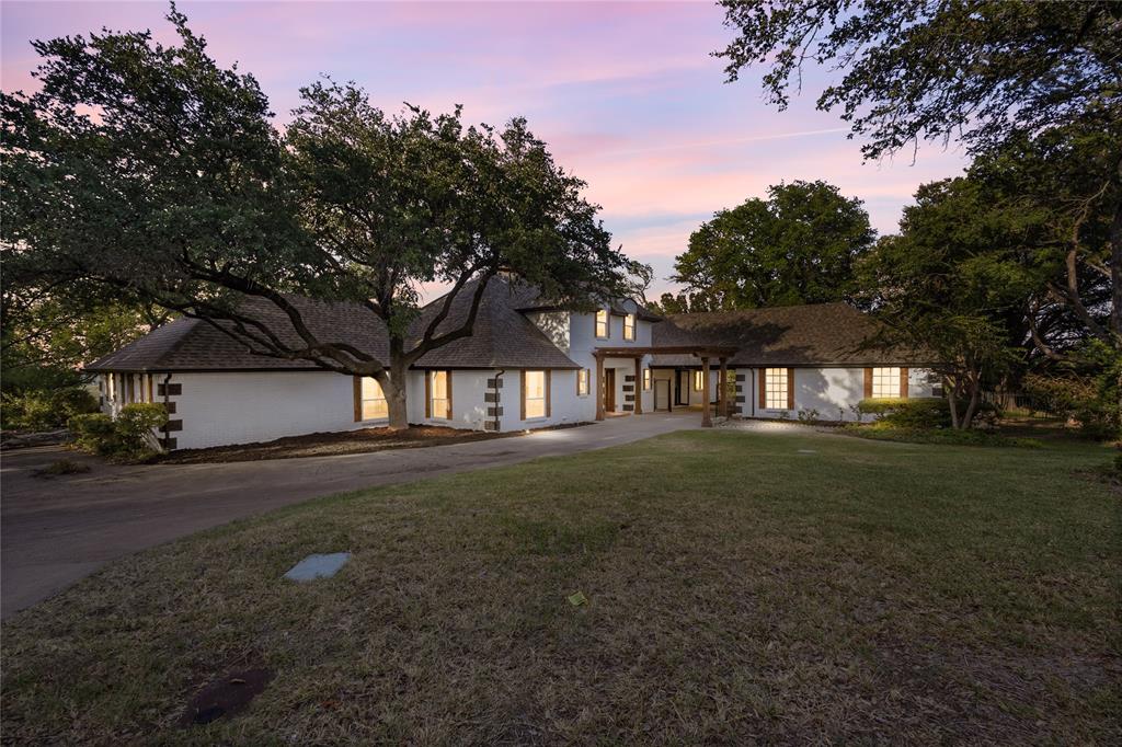 $5,000 SELLER’S CONCESSIONS! 
Welcome to this stunning 4-bedroom, 3.5-bathroom estate on 1.14 acres in the heart of booming Fort Worth. Spanning nearly 3,900 sq ft, this fully renovated home blends modern elegance with timeless charm. A versatile bonus room floods with natural light, making it ideal for a home office, gym, or reading retreat. The expansive kitchen showcases a statement island and panoramic views of the lush backyard. Unwind in the luxurious primary suite featuring a spa-like bath with a soaking tub, double vanities, and dual rainfall showers. Multiple living areas are filled with natural light and high-end finishes, including a custom wine bar that adds the perfect touch for entertaining. Exterior soffit lighting surrounds the home, highlighting its architecture and creating a warm, elegant glow after dark. Step outside to a unique elevated viewing deck nestled among mature trees—ideal for peaceful mornings or scenic sunset lounging. Equestrian lovers will appreciate the private horse stable, while the 2-car garage and additional carport offer ample space for vehicles and storage. The home’s thoughtful layout and modern upgrades provide both function and flow. Enjoy quiet evenings or host gatherings with ease in this serene outdoor setting. This rare Fort Worth gem offers space, sophistication, and lifestyle on a scale that’s hard to find.