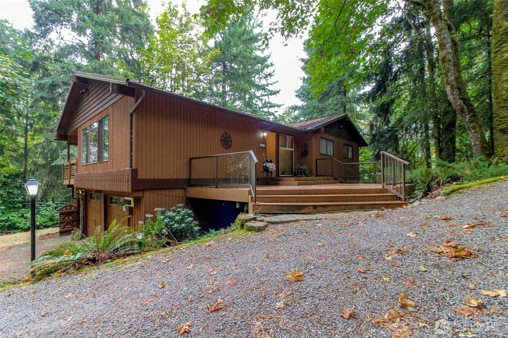 Opportunity to work on a blank slate as this home is worth it w/treed scenery on one of the larger lots in Eagles Mere, up from Somerset neighborhood.  Please have an appointment w/an agent to visit this rambler w/daylight basement as home is on a private driveway-a beautiful retreat into the woods, just a few minutes drive to downtown Bellevue!  The home is comfortable, boasting of 2 primary suites & lots of space! Enjoy the ambiance of the formal entertaining space w/vaulted ceiling in the entryway & the living room plus the dining room adjacent has two walls of window w/views of Evergreen trees on a .58 acre lot! Remodel the kitchen & consider taking out a wall to really open up the floor plan as you can tie the family room & eating nook together to create a huge great room (original floor plan available)!  The ground level, daylight basement is the perfect set up for a nanny's quarters as there is a second entrance from the side yard next to the 2 car garage. On this level you will find the 4th Bedroom (ensuite) which is 20 feet in length! This level also has a circular floor plan, just like upstairs, & includes not only the 2nd primary bedroom but a full sized laundry room, large office & rec room with a wall of windows to the backyard lawn.  This is the Perfect home to work from as it feels remote w/the lush Pacific NW Scenery! Your Cosmetic fixes to this 4 bedroom, 3 bath property could make this home be up to par w/the other 1.8 million dollar surrounding properties!