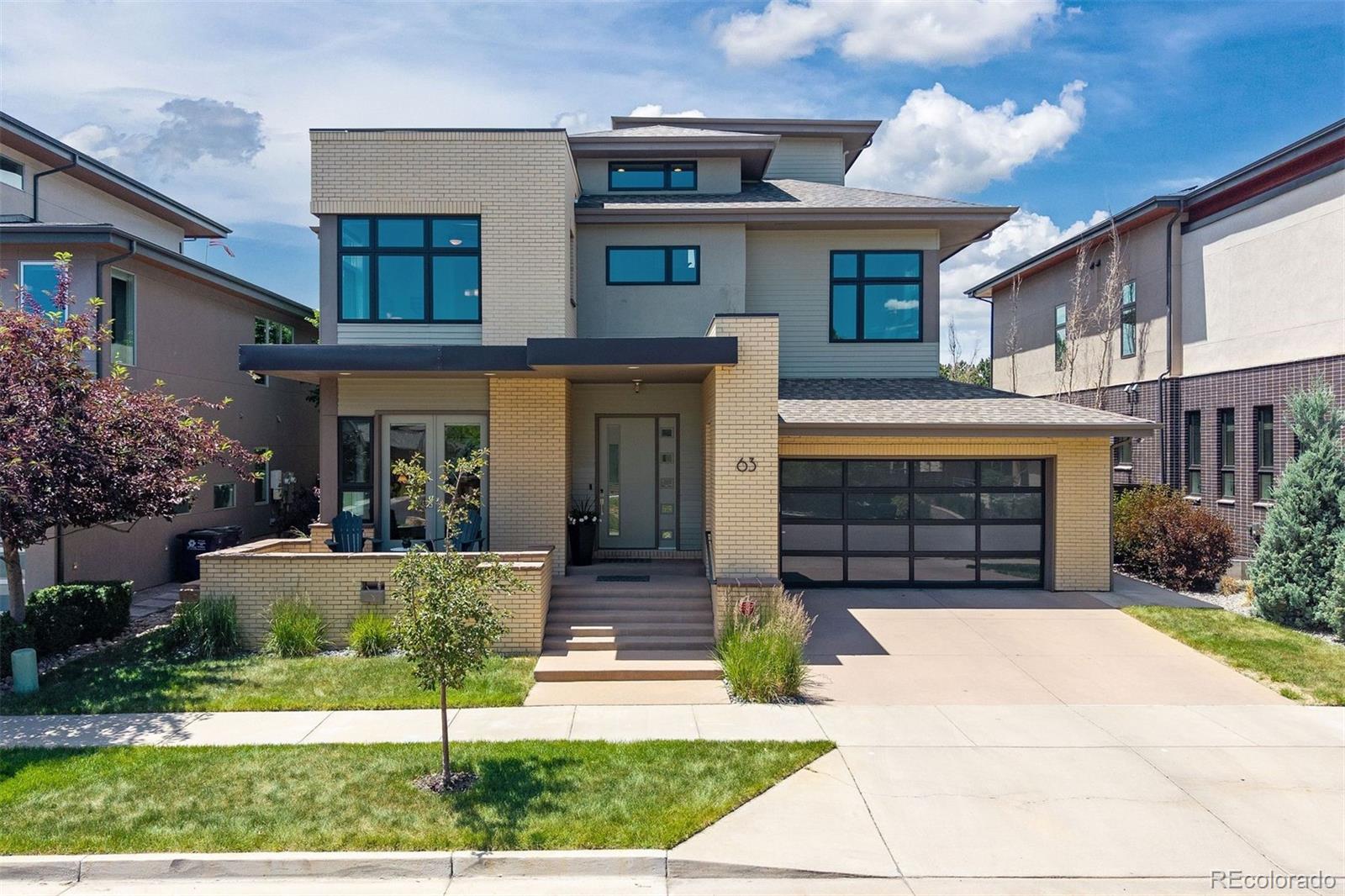 Showings begin Friday morning! Open house planned for Saturday (6/13) and Sunday (6/14)!Move-in ready and designed for modern living, this exceptional contemporary home offers 5 bedrooms and 7 bathrooms with an ideal layout for both everyday comfort and entertaining. The second floor features four spacious bedrooms, each with its own en suite bathroom, while the open-concept main level seamlessly connects the living, dining, and kitchen spaces. A private main-floor office opens directly onto the welcoming front porch, creating the perfect work-from-home retreat.The fully finished basement expands the living space with a guest suite, kitchenette/bar area, and ample room for recreation or hosting visitors. Upstairs, a third-floor recreation room with a full bathroom leads to a spectacular rooftop-style balcony showcasing sweeping city and mountain views. Additional highlights include a 3-car attached garage, 9-foot basement ceilings, included washer and dryer, and an owned solar system with 11 panels for enhanced energy efficiency. Thoughtfully designed with contemporary architecture and multiple outdoor living areas, this home offers the perfect balance of indoor and outdoor enjoyment.Located within walking distance of the Lowry Town Center, you'll enjoy convenient access to shopping, dining, and everyday essentials, including Target and Clark’s Market. The home is also walkable to Crestmoor Park and the Hilltop neighborhood, with popular local favorites such as Park Burger and Call Your Mother nearby. Situated within Denver Public Schools, with open enrollment opportunities available, this is a rare opportunity to enjoy a turnkey home in one of Denver’s most desirable locations.