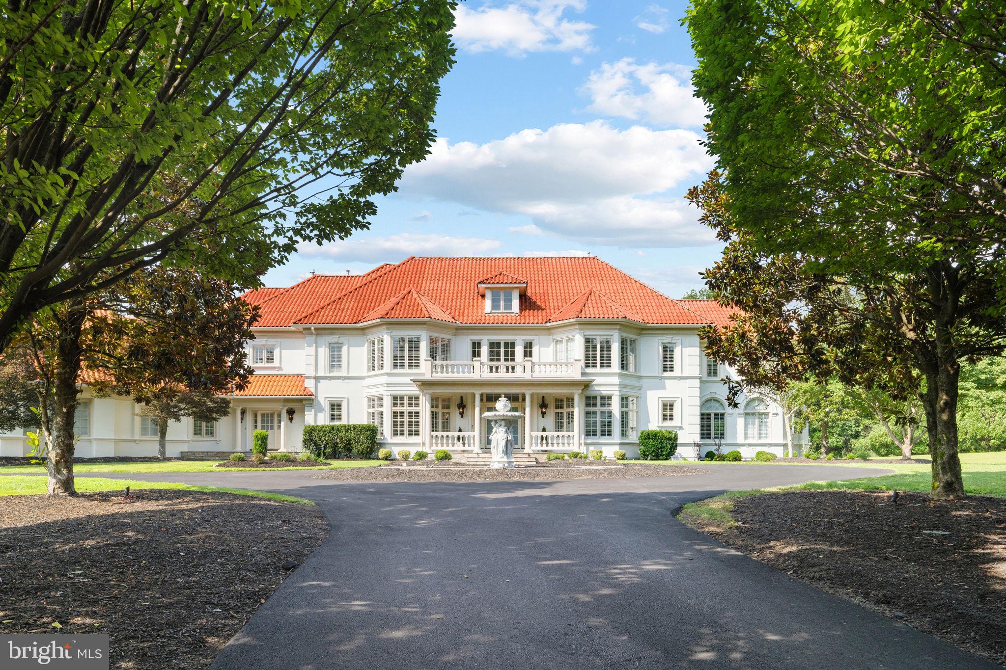 Welcome to an exceptional private estate offering resort style living in the heart of Great Falls! Set behind secure gates on more than five and a half acres, this Mediterranean inspired residence has been completely transformed with extensive brand new upgrades throughout, creating a turnkey luxury retreat ready for immediate enjoyment.The home spans over 12,000 square feet of newly updated living space designed for both everyday comfort and large scale entertaining. The open and airy floor plan flows effortlessly, ideal for multigenerational living and elegant gatherings. Every major system and finish has been thoughtfully replaced or upgraded, delivering the peace of mind that comes with essentially new construction. At the center of the home is a massive, yet cozy family room, drenched in daylight with floor to ceiling windows, a soaring stone fireplace extending to the ceiling that serves as a stunning statement piece, and a completely brand new chefs kitchen equipped with top tier Miele appliances, a cafe style gas range, quartz countertops, and custom cabinetry. This space is designed to impress while remaining highly functional for daily use and entertaining.Also on the main level is a one of the two primary suites, a grand formal dinning room, an elegant formal living room, along with a beautifully renovated sunroom filled with natural light that creates the perfect space for morning coffee, reading, or relaxing year round. And lastly, a brand new laundry and mudroom, thoughtfully designed with custom cabinetry, modern finishes, and functional storage.The upper level features a second expansive primary suite, along with four additional en suite bedrooms, all offering walk in closets and beautifully redesigned bathrooms. Each bath showcases brand new designer finishes including full slab marble showers, custom vanities, and modern fixtures inspired by luxury spa living.The walk out lower level offers a versatile entertainment experience with a private home theater, a large home gym that can easily be converted to a 7th bedroom, a full bath, expansive recreation space and tons of storage. Outdoor living is equally impressive with a heated saltwater pool, newly constructed basketball court, a pond, extensive new hardscaping, and a flagstone patio ideal for outdoor dining and gatherings.The circular driveway provides ample parking for over 25 vehicles in addition to the three car garage, making entertaining effortless. Major improvements include six new HVAC systems, new roof insulation, a newly paved driveway, and a newly added  generator installed in 2026.This is a rare opportunity to own a fully updated luxury estate where nearly everything is brand new. A true destination property offering privacy, sophistication, and resort level amenities in one of Great Falls most prestigious settings.Enjoy prime Great Falls location,  with just minutes to Tyson's corner, Route 7, and 495! And just  0.7 miles from Great Falls Village, home to popular restaurants and coffee shops, grocery shopping and other shops for everyday convenience.Schedule a tour today to fully appreciate the craftsmanship, scale, and setting of this remarkable home!Square footage information is deemed reliable but not guaranteed.