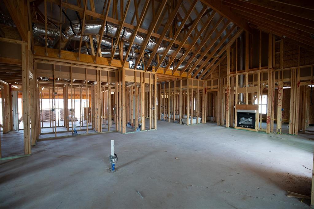 This Smith floor plan includes 3,515 Sq Ft of total living space, which includes 3,000 Sq Ft of indoor living space and 515 Sq Ft of outdoor living space. There is also a 640 Sq Ft, three-car garage with an in-ground storm shelter installed. This one-story luxurious home offers 5 bedrooms, 3 full bathrooms, 2 covered patios, a powder room, a large mudroom, and a utility room featuring a utility sink. The great room features a luxurious 3-panel sliding door, a ceiling fan, a center stacked stone surround gas fireplace, Cat6 wiring, rocker switches throughout, wood-look tile, and an exquisite cathedral ceiling with a crows feet detail that extends from the living room to the kitchen. The 5-star kitchen supports a large center island with a trash can pullout, stellar pendant lighting, 3 CM countertops, stainless steel appliances, including double ovens and a 5-burner cooktop, well-crafted custom cabinets to the ceiling, and lovely tile backsplash. The prime suite includes a sloped ceiling detail, windows, our cozy carpet finish, and a ceiling fan. The spa-like prime bath is attached and holds separate vanities with framed mirrors, a large European walk-in shower, a free-standing tub, a private water closet, tile flooring, and a huge walk-in closet. Outdoor living has a corner wood-burning fireplace, a gas line, and a TV hookup. Other amenities include a tankless water heater, an air filtration system, a fresh air ventilation system, double glazed vinyl low E windows, R-44 insulation, and MORE!