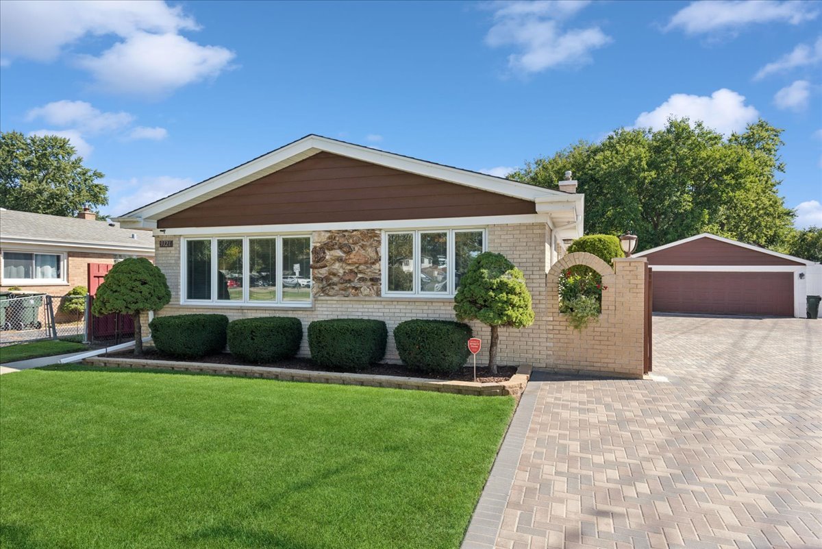 Welcome home to this 4-bedroom,2.5-bath home with curb appeal that starts at the street. A long, beautifully crafted brick driveway leads to an oversized 2.5-car garage. Out back, a matching brick patio carries the same craftsmanship into a private backyard retreat, ready entertaining or a morning coffee. The full basement features an oversized  family room, laundry room, bedroom, and a bar that will make any mixologist happy. Schedule your showing today.