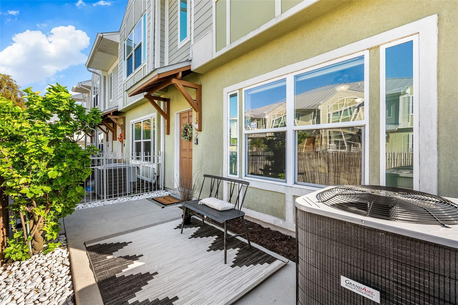 Enjoy the best of the Clearwater lifestyle in this inviting 3-bedroom, 2.5-bath END-UNIT townhome located directly across from Clearwater Country Club! The open-concept layout and natural light create a welcoming atmosphere, while the PRIVATE front patio offers a lovely spot to enjoy your morning coffee or unwind outdoors. The spacious primary bedroom features dual closets, and additional highlights include stainless steel appliances, built-in closet storage, a dedicated laundry room, a built-in sound system, and a 2-car garage. The A/C system was replaced in 2025. Community amenities include a swimming POOL, with a new PLAYGROUND coming soon. Beyond the community, enjoy convenient access to shopping, dining, and everyday essentials, along with nearby parks and the attractions of downtown Clearwater. Spend your days enjoying the beautiful sands of Clearwater Beach, stroll the scenic Beach Walk, catch the sunset at Pier 60, or explore waterfront events, dining, and entertainment at Coachman Park. With a combination of practical features, community amenities, and access to Clearwater's coastal lifestyle, this townhome is an opportunity to enjoy Florida living!