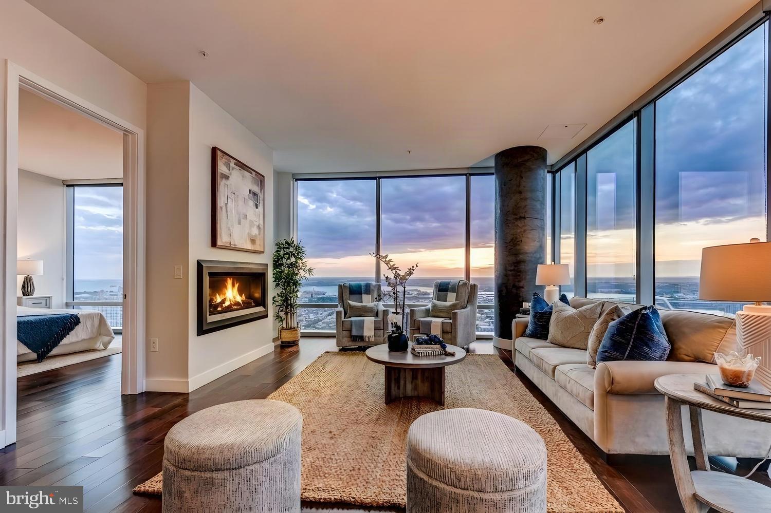 Experience the pinnacle of urban luxury living at 414 Light Street, a contemporary building in the heart of Baltimore's Inner Harbor.  The Tarragon penthouse, on the 43rd floor, is a modern 2-bedroom, 2-bathroom residence with a bright, open floor plan, floor-to-ceiling windows, an inviting fireplace anchoring the room, and city and water views - including the most amazing views of Camden Yards and M&T Bank Stadium, home to the Orioles and Ravens. The gourmet kitchen features stainless steel appliances, a spacious island, and a breakfast bar -  perfect for morning coffee while taking in the scenery.  The primary bedroom is a quiet retreat with a generously sized walk-in closet and a luxurious en suite bath.  The second bedroom offers an additional suite with its own bath and closet. Step outside to your private balcony, where panoramic city views will always dazzle. In addition to 24-hour security, the building offers a vast array of resident amenities - an outdoor pool with a waterfall and cabanas, al fresco kitchen and dining, a community entertainment kitchen and dining bar, resident lounge and theatre, a game room with billiards, a fireside retreat room with kitchen and dining, a private fitness club, a yoga studio, a large outdoor screen for building viewing events, and, for furry friends, a dog spa. Superbly located on Light Street, this unit offers easy access to the whole of the harbor area, from Federal Hill to Fells Point, and all the special attractions Baltimore has to offer. Easy access to 95 and 295 is a real plus for commuters, and the building offers parking for those who need it.  Available now for lease - come visit this beautiful unit and make it your new home.