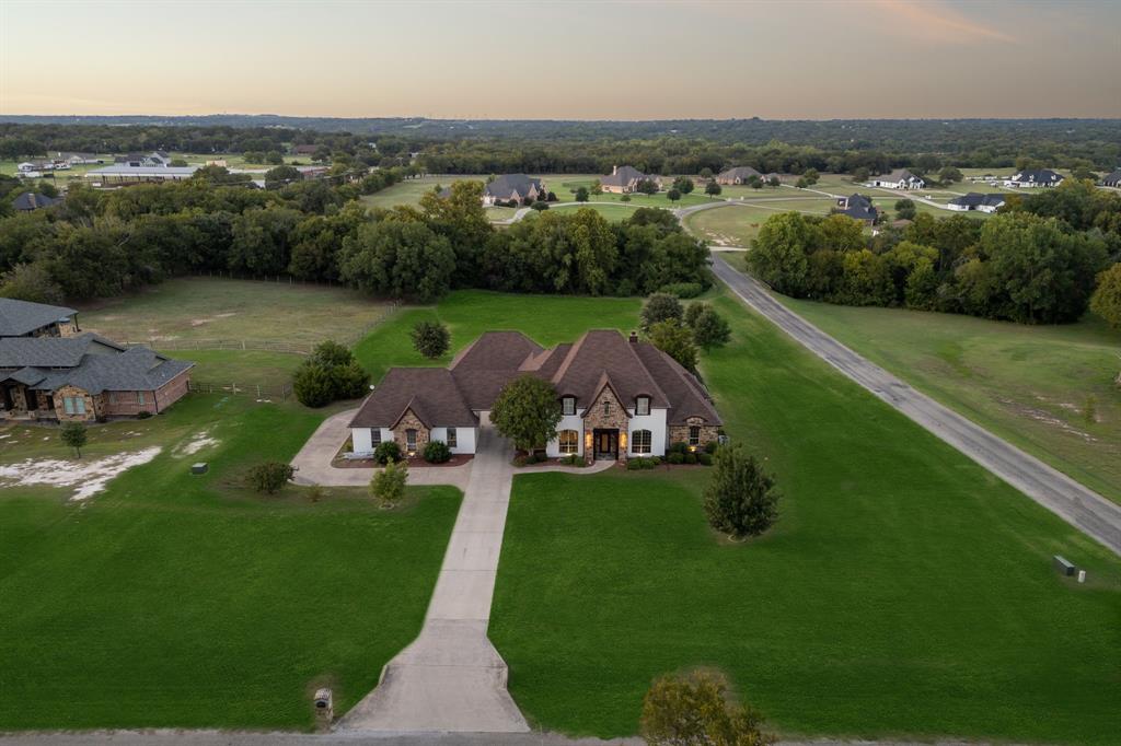 Stunning Estate in Exclusive Gated Equestrian Community! Welcome to this one-of-a-kind property located in a private, gated community featuring a 12-acre equestrian center with a covered riding arena, outdoor arena, and clubhouse—all maintained by the HOA and exclusively for homeowners.
Situated on 2.5 beautifully maintained acres, this custom home offers space, luxury, and flexibility. Boasting 4 spacious bedrooms (2 upstairs and two downstairs), a private study, 2 dining areas, multiple living spaces, an upstairs game room with a balcony, a home theater, and 5 total bathrooms, this home was built for comfort and entertaining. The chef's kitchen features beautiful quartz countertops, new backsplash, a butler’s pantry, and custom finishes throughout. Enjoy cozy evenings by the wood-burning fireplace in the main living room, or retreat to the luxurious primary suite with a sitting area, electric fireplace, and a spa-like bathroom. Storage is abundant, with tons of closet space throughout the home, including walk-ins and custom built-ins. Step outside to your private heated pool and spa, fueled by a buried propane tank, perfect for year-round enjoyment. A secondary downstairs bedroom with its own private bath and direct pool access makes an ideal guest or in-law suite. BONUS: This property includes an additional 1,100 sq ft of unfinished (and untaxed!) space, separate from the main home—perfect for a workshop, gym, home office, or future mother-in-law suite.
Recent upgrades & features include: fresh interior & exterior paint, new flooring, new light fixtures, aerobic septic system recently pumped, fireplace in master, remodeled master bath, and custom details throughout. This is a rare opportunity to own a home with exceptional amenities, unmatched space, and endless potential—all in a serene, upscale community just minutes from modern conveniences.