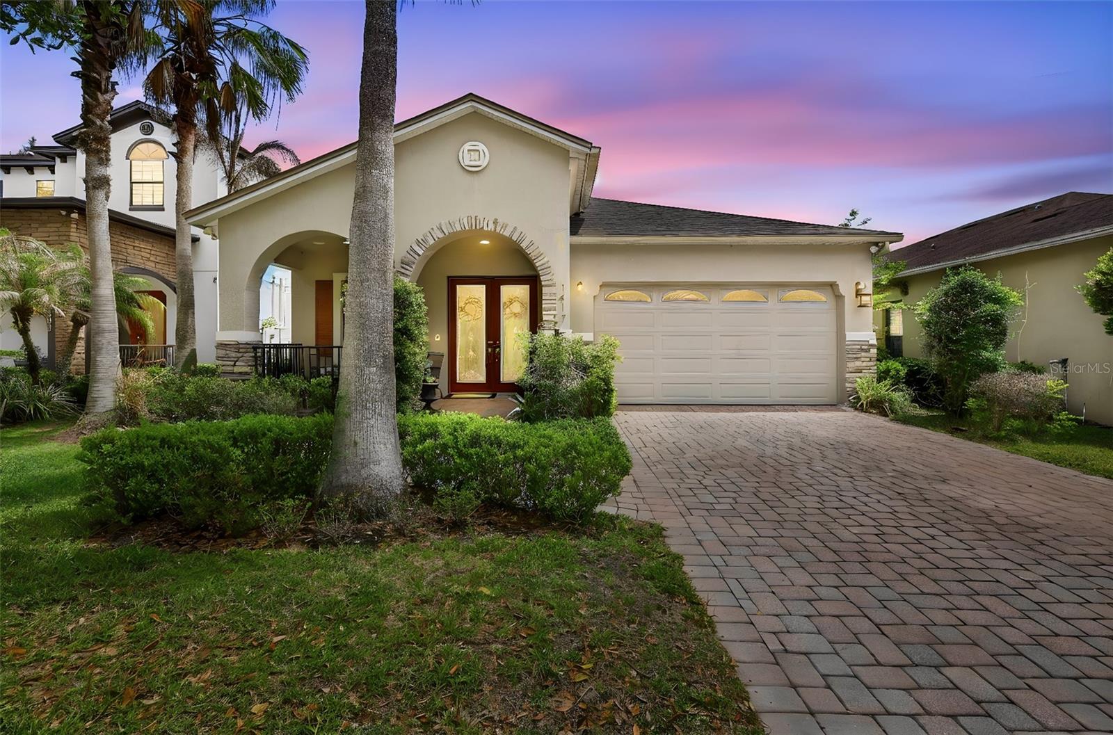 Welcome to the 24 hr .guard-gated community of Woodland Lakes Preserve, where this beautifully maintained home is perfectly positioned with views of the tranquil pond, fountain, and conservation area.Step inside through double glass doors and immediately feel the openness of one of the original model homes thoughtfully designed floor plan, highlighted by soaring ceilings and extra-wide custom crown molding adding elegance throughout. The living and dining room combination offers a welcoming space for gatherings, while the kitchen is sure to impress with its oversized one-piece granite waterfall island—not only functional as a breakfast bar but a  centerpiece adjoining the family room with its deco trayed ceiling.The home's real showstopper awaits just beyond the French doors…Step outside to your private backyard retreat—designed for true Florida living. The custom-built infinity-edge pool with waterfall and spa creates a resort-style setting, perfectly positioned to capture serene pond with fountain and conservation views. The expansive paver deck, lush tropical landscaping, and multiple lounging areas offer the ideal blend of relaxation and entertaining space. Whether hosting guests or enjoying a quiet evening, this outdoor oasis delivers both beauty and privacy.With the home fully wired for sound, you can set the mood throughout—whether you're cooking, swimming, or unwinding under the stars.Back inside, the spacious primary suite is a true retreat, featuring another beautiful tray ceiling, custom walk-in closet, and a luxurious bath complete with a large garden tub, walk-in shower, dual custom vanities with vessel sinks and makeup area, private water closet and spacious linen closet.NEW ROOF and WATER HEATER (2026)Close proximity to community pool, playground and mailboxesIdeally located near major highways, Waterford Lakes Town Center, UCF, and Orlando International Airport, this home offers both convenience and an exceptional lifestyle.