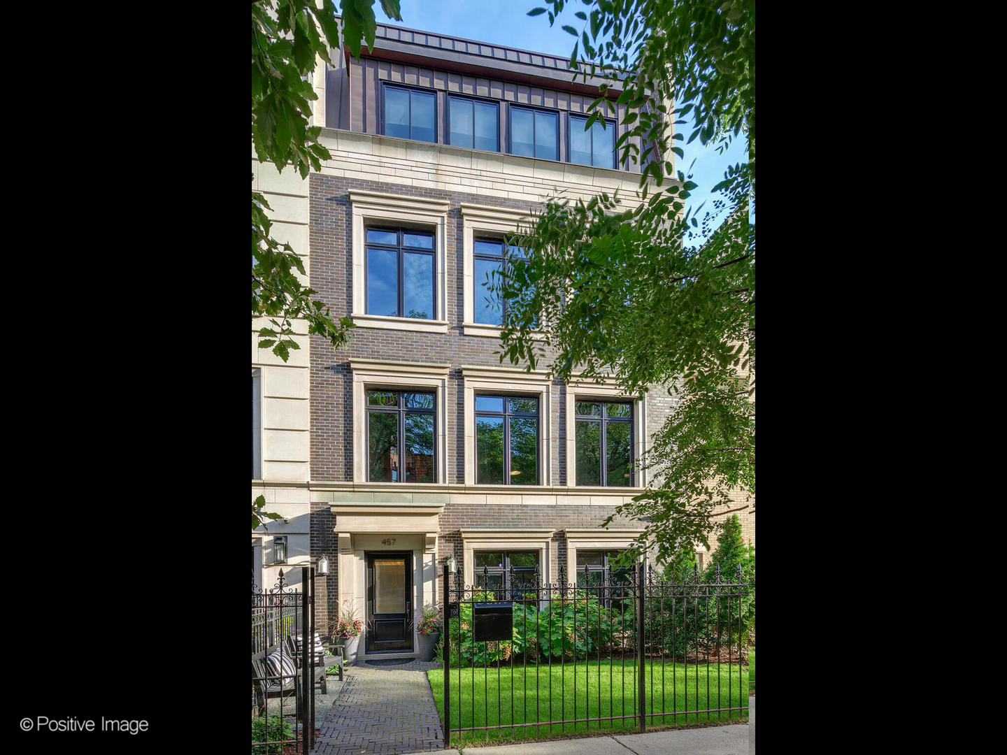 Unique newer brownstone, this custom-built residence offers unmatched luxury, an ideal layout and location convenience next to shopping, restaurants, the park and lakefront. This 5-level home with elevator has 5-bedrooms, all ensuite, and the largest upper-level suite apartment-like, dedicated primary floor. Bathed in natural light, the back of the home opens directly onto a private 1.25-acre park and showcases sweeping skyline views from its newly outfitted rooftop deck. Parking is unparalleled with a private, attached 2.5-car heated garage plus two additional on-site parking spaces-ideal for guests, staff, or service vehicles. A 4-stop passenger elevator and thoughtfully designed floor plan make this home the ideal city house.    The entry level welcomes you with a spacious foyer featuring a generous guest closet, a flexible fifth ensuite bedroom, which can be a home office or workout room featuring a full bath. This level also has a mudroom with abundant built-in storage that connects to the attached garage, complete with commercial-height ceilings and a loft storage approximately 200sf accessible by way of a pull-down staircase. Water spigot and industrial sink hook-ups are possible. The main living level, second floor, offers a newly redesigned expansive living room offering enough room for two separate seating areas, a unique, open-sided, gas ribbon fireplace and  floor-to-ceiling back glass doors facing south and leading directly to one of three private patios, the landscaped park at 2550 Lakeview, a dog run and easy access to the loading dock elevator, for easy furniture move-in, move-out. The spacious kitchen comes with an oversized walk-in butler's pantry, extra-wide refrigerator/freezer, full-height wine refrigerator, coffee bar, wine station, generous eat-in kitchen island and a built-in desk. Custom cabinetry, quartzite counters, dual dishwashers, and professional-grade appliances, round out this incredible kitchen along with a designated dining area and a gracious informal family room. There is a private 240sq. ft walkout deck with water, gas and Sono's speakers plus a bonus large second side-deck of 900-sq ft. unique to this home in the development, also with water, gas, Sono's speakers and an outdoor pool table. The third-floor level includes three generous ensuite bedrooms and two newly added stacked washer and dryer combos in the laundry room outfitted with cabinets and a wet sink. The fourth, top-floor offers a spectacular primary suite with a generous walk-in closet/dressing room and spa-inspired bath featuring radiant floors, a soaking tub, and an oversized steam shower. And, a dedicated large office space with built-in cabinets and a wet bar with refrigerator, which could also be used as a bedroom or flex room.  One floor up on the fifth-level is a brand new 900-sq.ft. full-sized roof deck with gas-fed firepit, Sonos speakers and a heated storage room which can also be used as an additional home office or art studio. Details throughout include soaring ceiling heights, custom millwork, and built-ins, all enhanced with security cameras, AV, Sono's and over 2,000 sf. of combined private, outdoor space from the three decked areas.  Ownership also includes full access to the unparalleled amenities of 2550 Lakeview-private park with playground, indoor pool and hot tub, state-of-the-art fitness center, spa facilities, courtyard with fountain and seating area, library with pool table, party room, recreation spaces, 30-seat theater, valet, dry cleaning, 24-hour security, and the exceptional uniformed staff that define the building. This is a home you'll be proud to present to your buyers. With its exceptional design, thoughtful details, first-class finishes, fully private, interior park access and full access to all of the 2550 amenities, it truly stands out as a top-notch property that will impress even the most discerning clients. We think there is truly nothing like it in