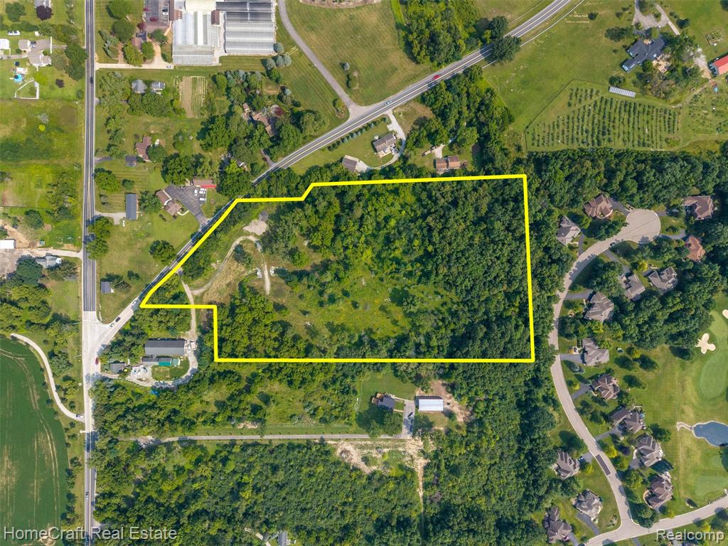This is a rare chance to own a stunning 12.3-acre wooded parcel in Lodi Township, with an Ann Arbor mailing address and access to Ann Arbor Schools. The property offers a unique blend of natural beauty, privacy, and proximity to everything Ann Arbor and Saline have to offer—all with the benefit of low Lodi Township taxes. It’s the perfect canvas for a luxury estate, business venture, or boutique farm. A stream runs through the property, mature trees provide year-round beauty, and it backs up to Travis Pointe Country Club, which is investing heavily in clubhouse and golf course enhancements. Owning land next to this exclusive, improving community only adds to its value and prestige. The Travis Pointe neighborhood is known for impressive custom homes on large, mature lots, ensuring any new build here will fit seamlessly into a sought-after setting. The location is second to none—just east of the Ann Arbor-Saline and S Wagner intersection, with recent and planned infrastructure improvements improving access. Downtown Ann Arbor, Saline, shopping, dining, and recreation are only minutes away. Demand for new construction in this area is strong, with many high-end homes selling well over $1M on smaller parcels. Here, you have over 12 acres to create a private estate, pursue equestrian or agricultural uses, or even explore subdivision with approvals. The property’s inclusion in Ann Arbor Schools adds value, with the potential option of Saline Schools nearby. Best of all, this parcel delivers the privacy and natural setting buyers crave yet rarely find so close to city conveniences. The wooded land, stream, and golf course backdrop make for a peaceful retreat that’s truly special.