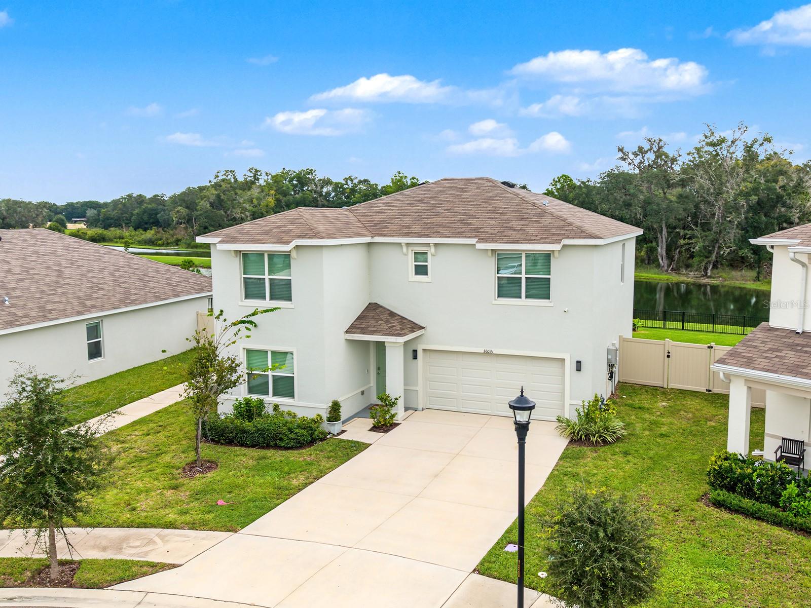 Welcome to this beautiful home located in the desirable Two Rivers community of Zephyrhills. This spacious 4-bedroom, 3-bathroom home features 2,371 square feet of living space with an open and functional layout designed for comfortable everyday living and entertaining.The kitchen opens to the main living and dining areas, creating a welcoming space for gatherings. The primary suite provides a private retreat with an ensuite bath, while the additional bedrooms provide flexibility for family, guests, a home office, or other needs. A 2-car attached garage provides convenient parking and additional storage.Residents can enjoy the community pool and all that the Two Rivers community has to provide. Conveniently located near shopping, dining, schools, parks, and major roadways, this home provides both comfort and convenience.Schedule your private showing and call this your new home!
