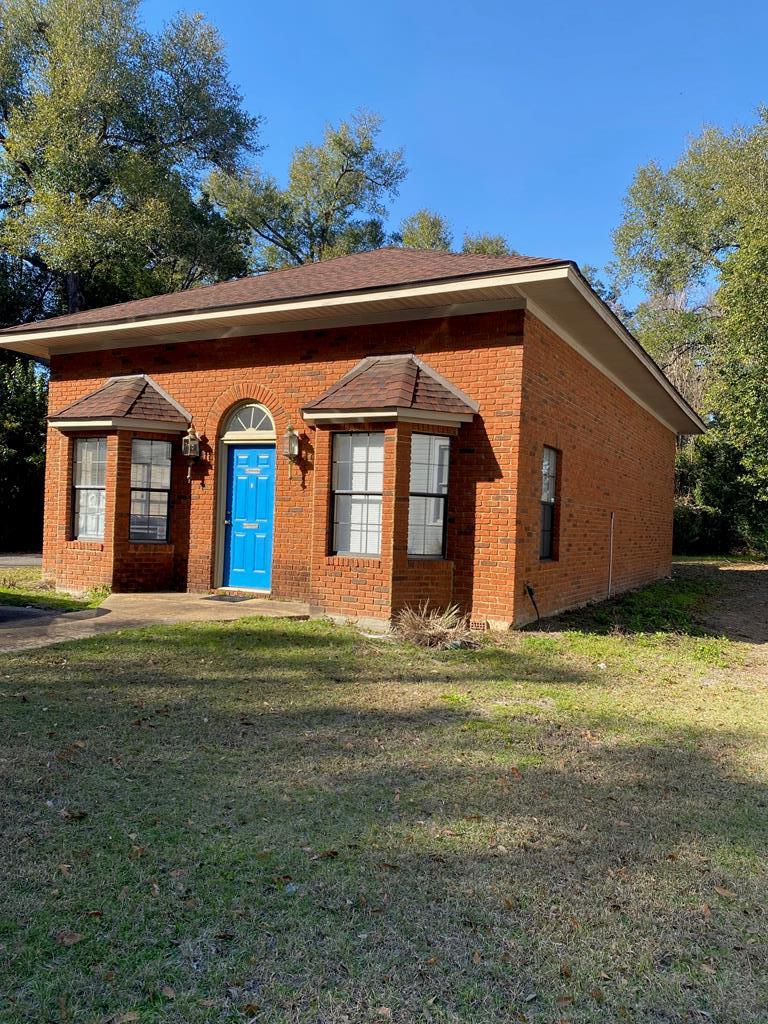 High Traffic location. This is an excellent brick commercial building that has a well-maintained interior and exterior.  The exterior has high traffic and parking in the rear and entrance door in the front as well as the back.    The interior has 4 enclosed offices with doors as well as a waiting room and a main office.  It also features 2 bathrooms and a kitchen area as well.  The owner will build to suit contingent upon price.