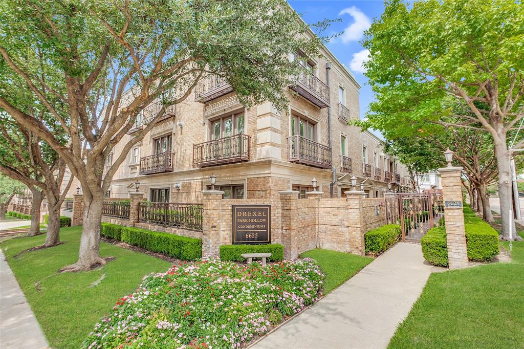 Luxury living in Preston Hollow’s finest condo development, the Drexel Park Hollow. This ground floor unit lives like a townhouse with private courtyards. Surrounded by an attractive brick wall, the secured courtyard entrance provides easy come & go. Or use the underground secured garage with elevator access to the entrance of the unit. The stunning interior offers wide open, generous proportions with 10 foot ceilings, travertine floors, and abundant natural light. The main living area enjoys a cast stone fireplace and access to your private terrace for morning coffee or evening relaxation. The versatile second living area provides a built-in office space with storage and file drawers, while also allowing space for a breakfast table and casual lounge area. The fully equipped kitchen offers granite counters and top appliances including Wolf gas range top, Thermador double ovens, Sub-Zero, Bosch DW, and microwave. Fabulous primary suite offers a sitting area, access to rear patio, and luxurious bath with double vanities, shower with frameless glass, jetted tub, and a closet requiring its own zip code! Perfect location near park + Preston Hollow and Park Cities restaurants and shopping. Easy to lock & leave accommodating a versatile lifestyle!