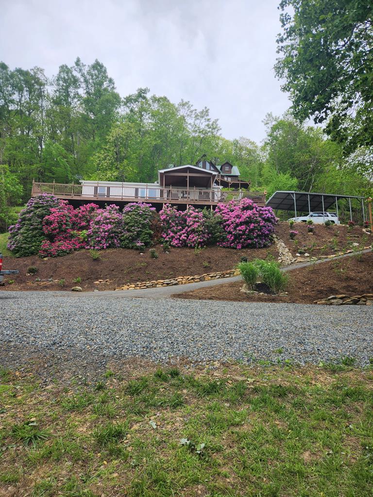 Discover your perfect mountain retreat in beautiful Fancy Gap, VA! This inviting 3-bedroom, 2-bath home is just minutes from the scenic Blue Ridge Parkway and offers breathtaking panoramic views of the Piedmont Mountains. Designed for both relaxation and everyday living, the spacious partially covered deck provides the perfect setting to enjoy stunning sunrises, colorful sunsets, and peaceful mountain scenery in every season. Inside, you'll find numerous recent updates, including beautiful new luxury water proof vinyl plank flooring, fresh interior paint.. The home also features newer windows (approximately 1 years old) and a newer HVAC system (approximately 1 years old), providing enhanced comfort and energy efficiency. Additional features include a whole-house generator, detached carport, storage shed, heat pump with propane backup, newer water heater, and a spacious, fully fenced yard with plenty of room for pets, gardening, or outdoor entertaining.  Whether you're searching for a peaceful full-time residence, a weekend getaway, or a second home, this property offers the ideal blend of comfort, convenience, and breathtaking natural beauty. Property access is also available via Red Bow Lane.  Don't miss this opportunity to own your own mountain escape in one of Southwest Virginia's most scenic locations!