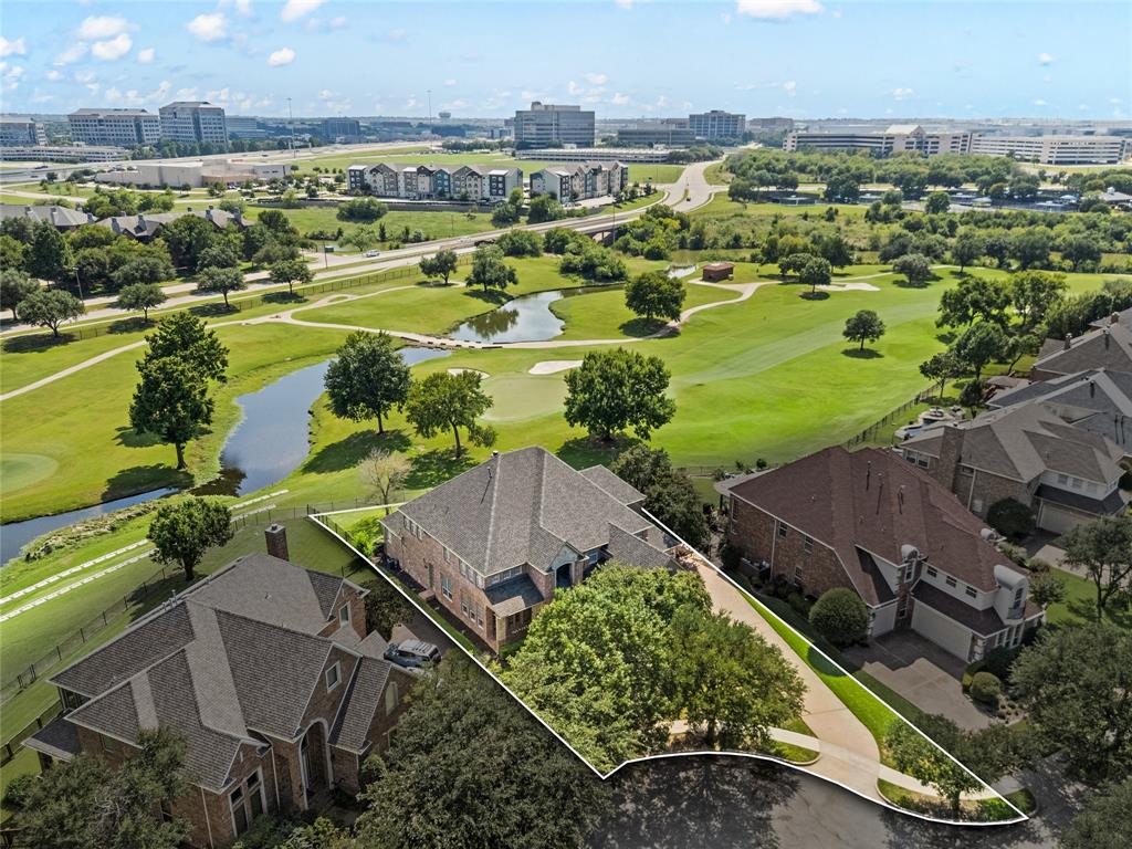 Welcome to this exquisite property! Nestled inside the guard-gated Hackberry Creek community, you will enjoy the picturesque view of the hole one green of the Byron Nelson designed course within Las Colinas.
Tucked away on a pie shaped lot, the stone and brick facade, combined with the meticulously manicured landscape and brand new roof, create the ideal curb appeal. 
Upon entry, you are greeted by hand-scraped wood floors that cover the entire main level. From the foyer there are sight lines through the main living room, complete with gas fireplace and a custom wood wall, straight through the back yard and onto the first green. The entry is flanked by a formal living space overlooking the large covered front porch. Just across the entry is a formal dining room perfect for hosting large groups.
The open concept kitchen serves as the perfect place for intimate family dinners or entertaining friends and family. A full sized, stainless steel, built-in refrigerator, gas cooktop, and sprawling counter space make this area fitting for even the most demanding of chefs. 
Just past the executive office with bold built ins, the primary suite, with bay windows overlooking the back yard and golf course, is intimate and impressive with a well maintained ensuite bath and substantial walk-in closet.
The spiraling wood staircase leads to four additional bedrooms, two with ensuite baths, one of which serves as s second primary and has direct access to a covered patio. The 2nd level game room is flexible to meet anyone's needs and desires. From media to music room to billiards, the possibilities go on and on. 
The backyard is where the real fun happens. The wrap around porch allows you to take in relaxing sunsets as you watch golfers stroll by. The large, open yard provides an ideal space for play, entertainment, or that awe-inspiring pool you've always dreamed of. 
Every inch of this home has been freshly painted and is ready to impress!