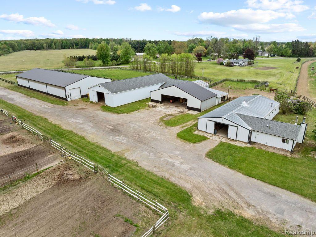MOTIVATED SELLERS! BRING ALL REASONABLE OFFERS! Nestled on 41.12 acres of stunning land, this 3-bedroom, 1-bath ranch home offers both comfort and functionality, making it the perfect retreat for equestrians or anyone seeking a serene rural lifestyle. Whether you're a horse enthusiast, farmer, or simply love wide-open spaces, this property has it all. the home features beautiful views of the surrounding acreage. The open floor plan features a large living area and a functional kitchen. Relax in the quiet, peaceful setting or step outside to take in the fresh country air. Outside you'll find a 60x143 Indoor Arena – covered space ideal for year-round training, riding, or events. Main Barn – Includes 11 stalls (12x12 and 12x15), plus additional stalls at the rear. The barn features a tack room for all your gear and easy access to the paddocks (with automatic waterers!) and riding areas. Second Barn – Offering 6 stalls (10x12) with space to add 6 more, this barn provides ample room for your horses. It also includes an office/lounge with a half bath, perfect for managing your property or unwinding after a long day in the barn. Attached 1-Bedroom Apartment – Ideal for staff, guests, or as a private retreat, this cozy living space is fully functional with a kitchen and bathroom. 1/2 Mile Track – Perfect for conditioning horses or turn out as it is completely fenced in. 2 Outdoor Riding Areas – Sand (150x200) and grass (300x300) Offering plenty of room for training, jumping, or recreational riding in a variety of settings. Pond with Beach Area – A serene spot for relaxation or enjoying a sunny day. The beach area is perfect for cooling off in the summer. Alfalfa Field – A couple acres of lush alfalfa ready for harvest or grazing. This incredible property is the ultimate combination of private, peaceful living and top-notch equestrian amenities. Whether you're training horses, breeding, or just need room to roam, this property offers everything you need and more.