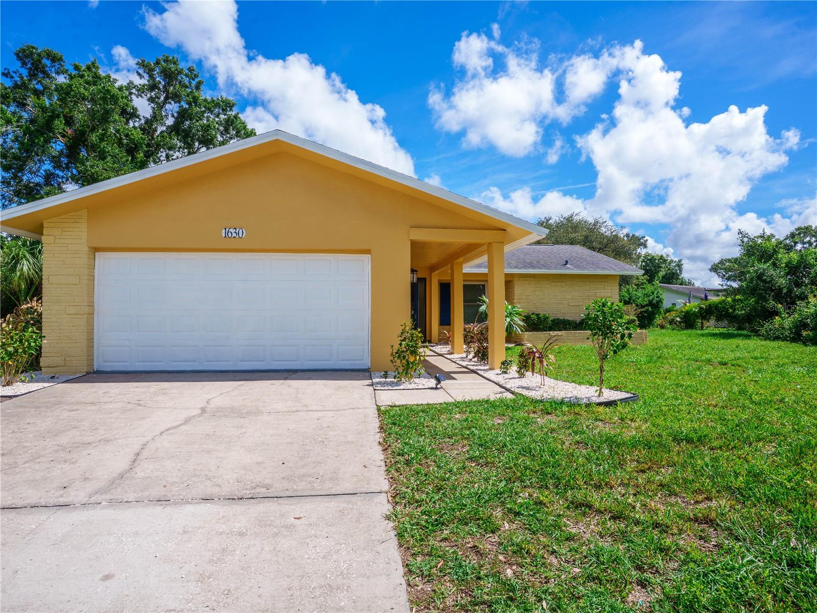 Boasting exceptional curb appeal and a freshly painted exterior, this beautifully updated 2-bedroom, 2-bathroom, 2-car garage home makes a stunning first impression. Nestled quietly at the end of a peaceful cul-de-sac within the highly sought-after Highland Lakes area, this property offers a rare and incredibly unique opportunity: enjoy neighborhood living without the restrictions or mandatory fees of an HOA, while retaining the exclusive, voluntary option for buyers to buy into the community amenities if desired. Step inside to a bright, turn-key interior featuring fresh professional paint and brand-new flooring throughout. The immaculate kitchen comes fully equipped with brand-new, never-used appliances, making the entire home completely move-in ready. The outdoor presentation is just as impressive as the interior, highlighted by its freshly painted facade and immaculate curb appeal that welcomes you home every day. Perfectly situated for the ultimate Florida lifestyle, you are just minutes away from premier local shopping, dining, and pristine area beaches, with Tampa International Airport located approximately 90 minutes away for effortless travel.Call today for your private viewing of this stunning home.