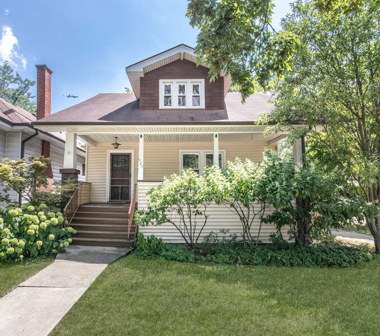 Fall in love with this charming 3-bedroom, 1-bath home just blocks from Uptown Park Ridge!  Step inside to find hardwood floors, a cozy fireplace, and built-in shelving. The kitchen shines with custom cabinets, stainless steel appliances, a beverage fridge, and a walk-in pantry. You will find a bonus room on the main level, perfect as a home office or extra bedroom.   Enjoy evenings on the inviting front porch or the screened-in back porch, overlooking a fenced backyard.  A custom 2-car garage can be found with alley access and abundant storage.    Don't miss this unique opportunity to live in a prime location!  Property being sold AS-IS