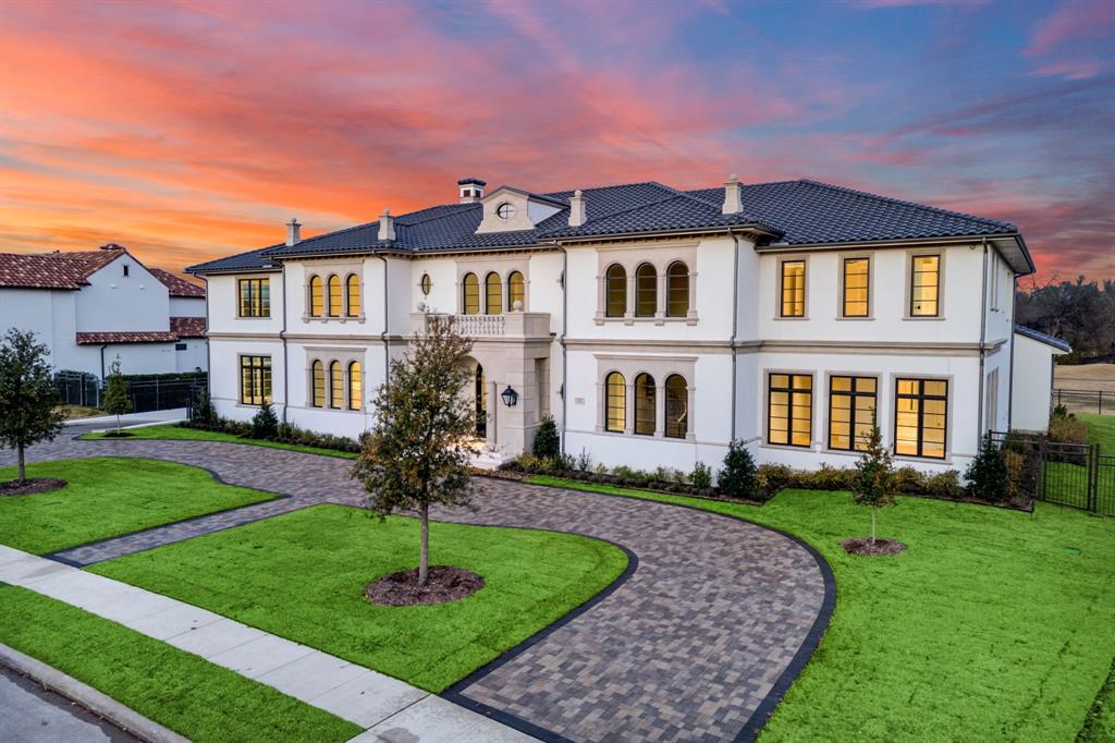 This extraordinary Neoclassical-inspired estate is poised to become one of North Texas’s most iconic luxury residences. Thoughtfully designed by Lloyd Lumpkins Architects and meticulously built by Sharif-Munir Custom Homes, the property seamlessly blends timeless European elegance with Mediterranean sophistication. Set on a premier lot backing to Hole 3 of the Arnold Palmer Signature Course, the home spans over 13,000 square feet, with an additional 5,000+ square feet in a fully finished basement, thoughtfully crafted for refined living, lavish entertaining, and the most discerning lifestyle. A dramatic entry hall welcomes you into a grand interior anchored by a gallery with groin-vaulted ceilings. Among the home’s planned features are a Gilded Age-inspired sunroom with soaring windows, a private gym that opens to a covered patio with automatic drop-down screens, a full sauna, an oversized game room, and a grand media room pre-wired for speakers. The expansive living spaces are both elegant and comfortable, centered around a chef’s kitchen equipped with top-tier appliances, a secondary spice kitchen, and a spacious butler’s pantry. Designed with flexibility and privacy in mind, the home offers seven bedrooms and eleven bathrooms, including a fully equipped multi-generational suite with a separate entrance. Outdoor living will be nothing short of spectacular, featuring a large covered patio and upper balcony, both with automatic screens, alongside a summer kitchen perfect for year-round enjoyment. A private drive-down ramp leads to a six-car basement garage with a dedicated storage room. The property also includes smart home technology. Located within the exclusive, guard-gated Wimberly Place, Allen’s only neighborhood of its kind. This property doesn’t just offer a place to live, it offers a way to live.
