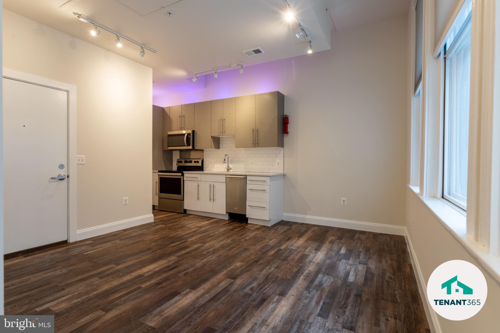 AUGUST MOVE-IN!!  Experience the epitome of urban living in this stunning one bedroom apartment located in the heart of Downtown Baltimore. Recently renovated in 2022, this mid-rise gem boasts luxury vinyl plank flooring and high-end appliances, including a front-loading washer and dryer, refrigerator, and stove, ensuring both style and convenience. Enjoy breathtaking city views from your home, complemented by 24-hour security and a comprehensive security system for peace of mind. The lease includes essential amenities such as internet, security monitoring, trash removal, and discounted parking, all while being fully furnished for your comfort. With a minimum lease of 3 months and a maximum of 24, this exclusive residence is available starting March 2, 2026. Embrace a lifestyle of sophistication and ease in this beautifully appointed space, where every detail has been thoughtfully curated for your enjoyment. Don't miss the opportunity to call this luxurious apartment your home.