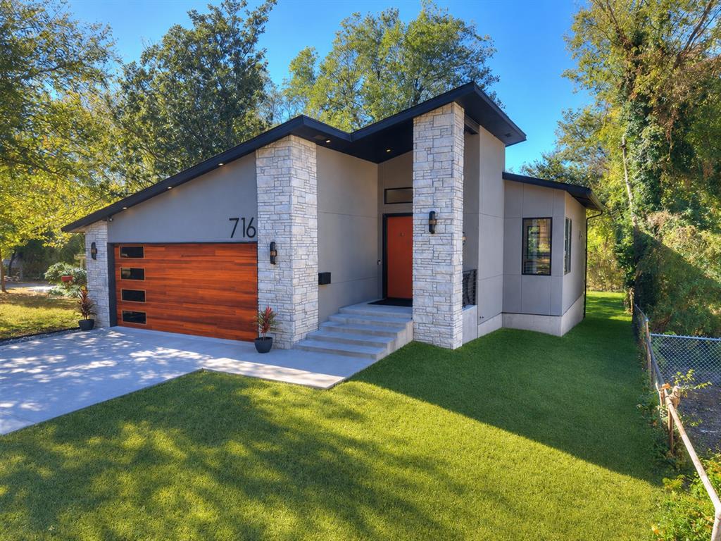 Modern Scandinavian design meets prime Norman location in this stunning custom-built home. Perfectly positioned across from McKinley Elementary and just blocks from the OU campus, this residence offers contemporary style in one of Norman’s most desirable neighborhoods. Outside, the striking architecture surrounded by mature trees creates head-turning curb appeal. Inside, the main level showcases an open-concept layout anchored by rich wood floors, abundant natural light, and expansive Pella windows framed in dramatic dark trim. A sleek fireplace adds warmth and sophistication to the living space.The kitchen is effortlessly refined — centered around a generous island ideal for gathering, prep, or casual dining. Sleek yet subtle cabinetry offers abundant storage and is complimented by a spacious walk-in pantry. Top of the line appliances including a built-in wine/beverage cooler. The dining area opens to a private deck overlooking mature trees and peaceful natural views.The primary suite, conveniently located on the main level with back yard views, offers a spa-inspired bathroom with heated floors, a spacious walk-in closet and direct access to the laundry/mudroom for ultimate functionality. The partially below-grade lower level adds exceptional flexibility, featuring two additional bedrooms, a full bath with heated floors, dual vanities and a large walk-in shower. There is an expansive second living area with a built-in bar — ideal for movie nights, game days, or a private retreat for guests, plus a  study/flex room! There is also a large finished storage room area that is not included in the s.f.! With its modern finishes, thoughtful layout, multiple living areas, and unbeatable location, this home delivers elevated comfort and design tailored for today’s lifestyle. Floor plan is attached in supplements.