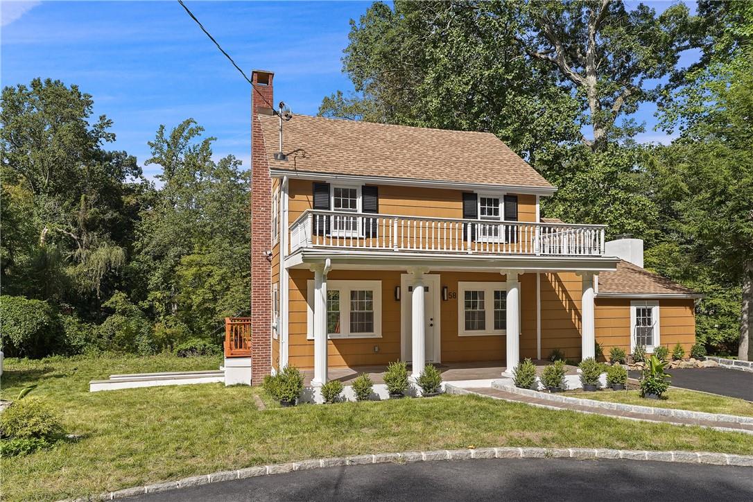 Move right in to this renovated farmhouse colonial. The new kitchen with quartz countertops, spacious island and stainless appliances is open to the dining area with door to deck and flows into the living room. Step down to a large family room with fireplace and new full bathroom. Upstairs is a newly renovated bathroom with walk in shower and two bedrooms, one with a walk-in cedar closet. The lower level offers plenty of additional space with storage area, laundry, utilities, and door to yard. The property is located very close to Armonk town and offers a great front porch, spacious deck and flat yard. Byram Hills Schools.