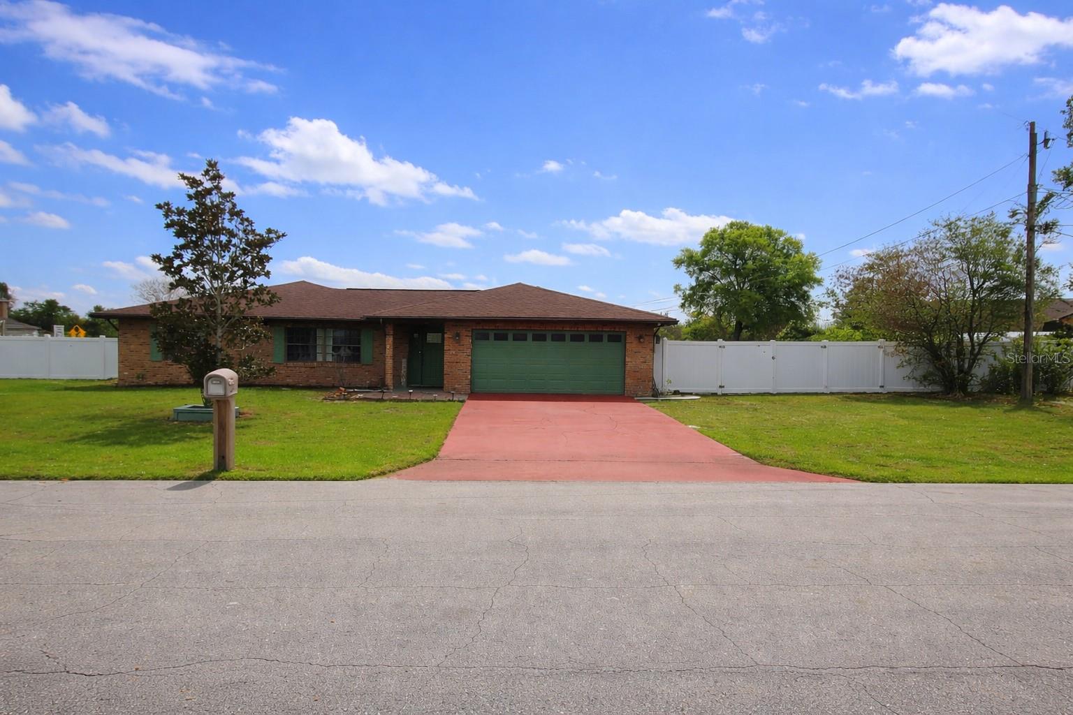 One or more photo(s) has been virtually staged. Welcome to this Spacious 4-bedroom, 2-bathroom pool home located on a corner lot in Deltona, offering approximately 2,174 square feet of living space with a brick exterior, extended driveway, and 2-car garage.The interior layout offers multiple living areas with great natural light. Skylights in the living room and great room enhance the open feel, while the great room features vaulted ceilings, recessed lighting, and French doors leading to a 32 x 12 covered lanai and screen-enclosed, solar-heated pool.The family room includes a wood-burning fireplace, creating a central gathering space within the home. The kitchen is centrally located with functional flow into the surrounding living areas.The split bedroom floor plan offers added privacy. The primary suite includes walk-in closets and an updated Jack-and-Jill bathroom connecting to an adjacent bedroom, ideal for flexible use such as an office or additional bedroom. Two additional bedrooms and a second full bathroom are located on the opposite side of the home.Recent updates include luxury vinyl flooring in the bedrooms (2023), vinyl fencing (2023), roof (2018), A/C (2022), water heater (2022), and a new pool pump. The home is equipped with solar panels that are paid off, offering potential energy efficiency benefits.Additional features include concrete block construction, an oversized two-car garage, and a storage shed in the backyard. The property offers outdoor space while being conveniently located near I-4, shopping, dining, and access to the Orlando area and nearby beaches.Tenant occupied through 04/30. New professional photos coming soon. See showingtime for showing instructions.