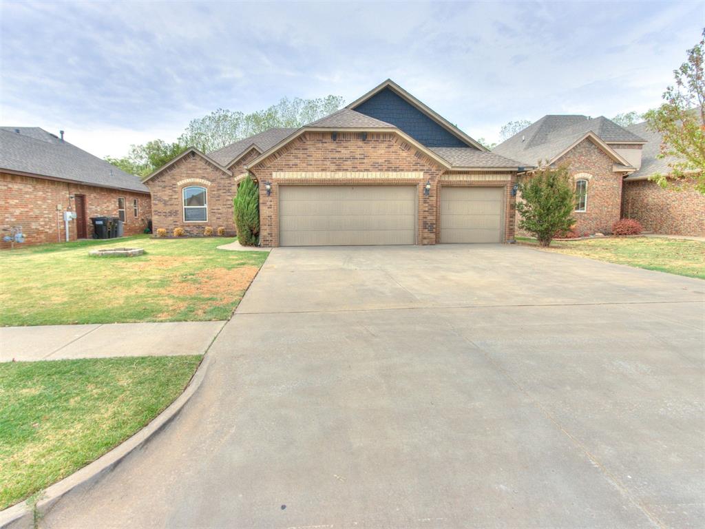 Welcome to Lake Woods! This meticulously maintained abode has it all with a split floor plan of 3 beds + an office & 3 car garage. Entertaining is easy with the open concept living/dining space! The kitchen features beautiful cabinetry with lots of storage, a breakfast bar & granite countertops. The master bedroom is quite grand with the vaulted tray ceiling. The en suite has dual vanities, a whirlpool tub perfect for soaking and a large walk-in closet. Secondary bedrooms are a great size & on the opposite side of the home for privacy. Check out the massive backyard which boasts a fire pit that will fit all of your friends and family around it. This home is complete with a garage storm shelter, entryway mud bench and neutral paint throughout! Come see all that Lake Woods has to offer with the stocked pond, walking trails and close proximity to shopping & the highway.