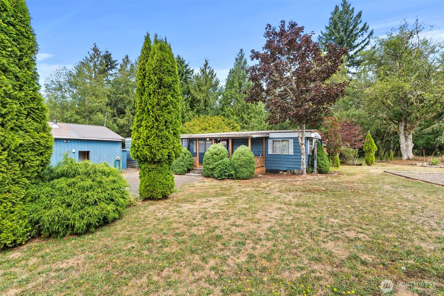 Looking to truly disappear? Hidden between Winston Creek and Salmon Creek Rd, this private retreat offers pasture, trees, a creek, and total seclusion. Includes a clean 1984 manufactured home with 660 sq ft of added living space for a total of 1,584 sq ft, a 24×42 shop with studio apartment (toilet & shower), loafing barn, storage sheds, general-purpose building, and canopy covers. Ideal for off-grid living—yet power, water, and septic are all in place. Hunt, fish, explore by ATV, or just enjoy the quiet. Close to Riffe & Mayfield Lakes, Gifford Pinchot Forest, and White Pass. Oh—and there’s a butcher shop nearby. Cash or possibly conventional, sold as-is. No repairs—just peace. Buyer to verify all information to their satisfaction.