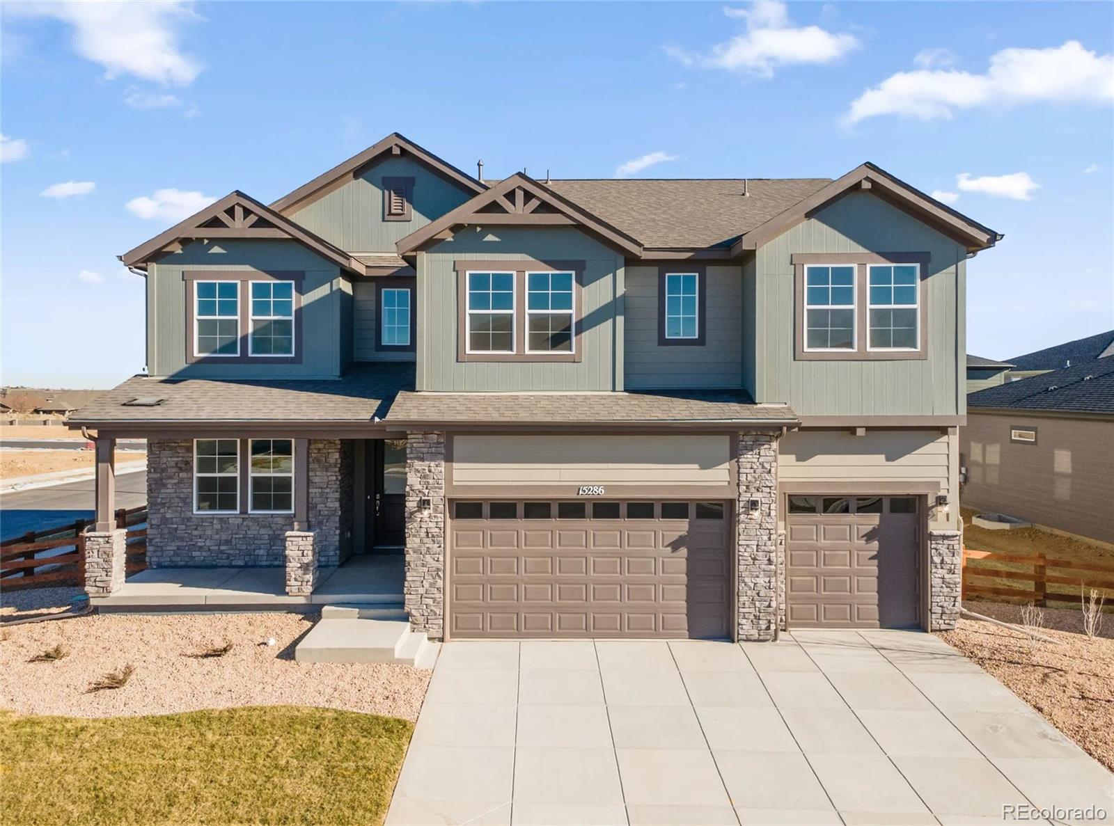 Introducing the highly sought-after 5006 floorplan — a stunning 3,263-square-foot residence offering 6 bedrooms, exceptional design, and remarkable versatility, perfectly positioned on a premium corner lot in Talon Pointe with a full basement.Step inside to a breathtaking two-story great room where soaring ceilings and expansive windows flood the space with natural light. A dramatic floor-to-ceiling tiled fireplace anchors the room, creating a striking architectural focal point and an inviting atmosphere for gathering and relaxing.The chef's kitchen is thoughtfully designed for both elevated entertaining and everyday living, featuring a sleek cooktop with statement hood, abundant cabinetry, generous prep space, and seamless flow into the dining area and great room. Whether hosting holidays or enjoying a quiet evening at home, this layout delivers effortless function and style. Extend your living outdoors to the covered patio — ideal for year-round Colorado enjoyment.With six generously sized bedrooms, this home offers rare flexibility. Two private en-suite bedrooms — including one conveniently located on the main level — provide ideal accommodations for guests or multi-generational living. Upstairs, spacious secondary bedrooms accompany a luxurious primary retreat complete with a spa-inspired five-piece bath designed for comfort and relaxation.Built with care and meticulous attention to detail, every space reflects thoughtful planning and elevated finishes. A three-car garage provides ample storage, while the corner lot enhances privacy and curb appeal.Located just four minutes from E-470, Talon Pointe offers unmatched accessibility to DIA, the Denver Tech Center, downtown, mountain recreation, and exceptional shopping and dining. Residents enjoy a massive community park and integrated trail system, creating the perfect balance of convenience and outdoor lifestyle.