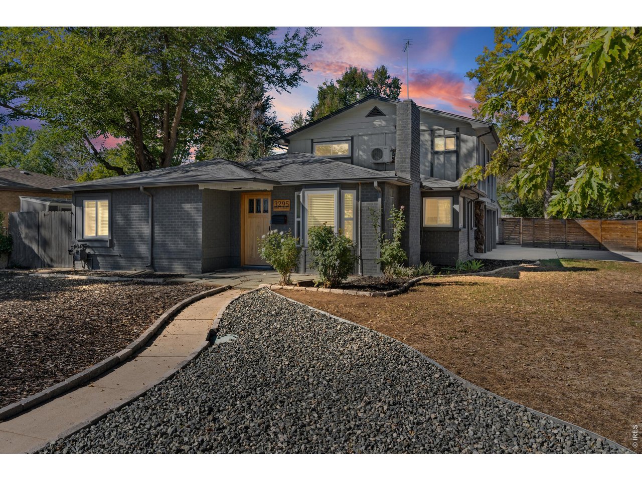 Live the best of Colorado living in this beautifully updated home where privacy, flexibility and an incredible location come together. Set on a large corner lot in a quiet, tree-lined neighborhood with a small-town feel, this home offers a lifestyle that makes it easy to enjoy both your own space and everything nearby. Inside, fresh interior paint, new windows throughout, updated plumbing, updated electrical with 200-amp service, mini-splits throughout, and a newly remodeled kitchen create a move-in-ready home with thoughtful modern updates. The flexible layout offers 3 bedrooms, 2 bathrooms, sunroom, and two living spaces, giving everyone room to gather, work or unwind. The spacious primary suite provides a peaceful retreat, while the second living/bonus area is perfect for entertaining, hobbies, a home office or game nights. The covered back porch is truly an extension of the home and a favorite place to start the morning with coffee, relax in the evening or gather with friends and family. The mature trees, large yard and corner-lot setting create a wonderful sense of privacy, while the indoor/outdoor connection makes everyday life feel special. For those who need space for vehicles, hobbies or projects, the property delivers in a BIG way with a 2-car attached garage PLUS a HUGE additional shop-an exceptional feature for anyone needing serious workspace or storage. Located centrally with easy access to local businesses, breweries, restaurants, shopping, biking, walking and jogging, plus Sloan's Lake, Berkeley/Tennyson, the Highlands and downtown Denver are all minutes away! Mountain adventures are also easy to reach. Quiet. Spacious. Modern. Private. Connected. This is more than a house-it's a place to enjoy the way you live.