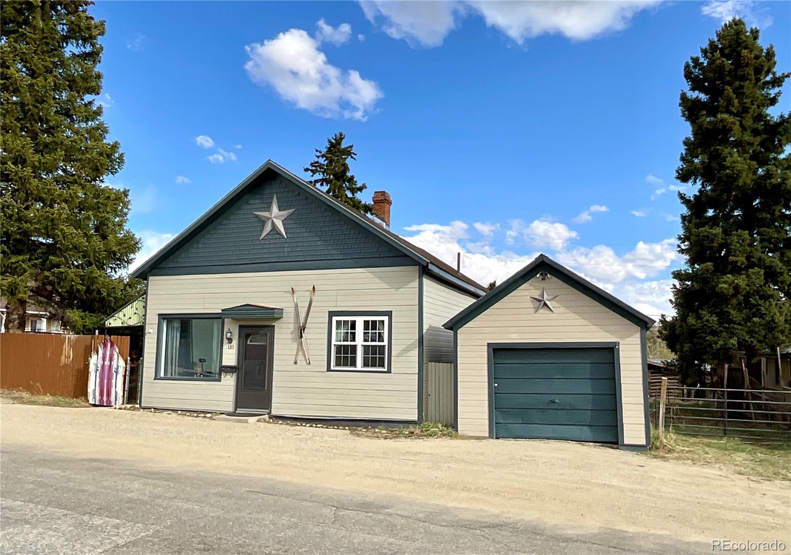 Ideally located just one block off Harrison Avenue, this beautifully updated home offers the perfect combination of convenience, comfort, and classic Leadville charm. Enjoy a quiet residential setting just steps from downtown shops, restaurants, and community events, with ample parking available on the block. Situated on a generously sized 0.15-acre lot—larger than many properties in the neighborhood—this home features a fully fenced backyard with mountain views, and plenty of outdoor space to relax or entertain.Inside, you'll find airy 9'5" ceilings, abundant natural light, fresh interior paint, new carpeting, and tasteful updates throughout. The kitchen has been refreshed with a new butcher block countertop at the sink area, along with a new stainless-steel refrigerator and glass-top range. Both bathrooms have been updated, creating clean, modern spaces. Additional recent improvements include a new large-capacity washer and dryer and a high-efficiency combi boiler installed in 2024, providing peace of mind for years to come. Storage and workspace are exceptional for an in-town property, with a detached garage off the street and a substantial 409-square-foot storage shed—perfect for outdoor gear, tools, motorcycles, seasonal equipment, and all the toys that come with mountain living.This is a rare opportunity to own a move-in-ready home on an oversized lot in one of Leadville's most desirable downtown locations. THIS IS A MUST SEE HOME which feels like a spacious Victorian. Sold furnished with some sentimental exclusions.