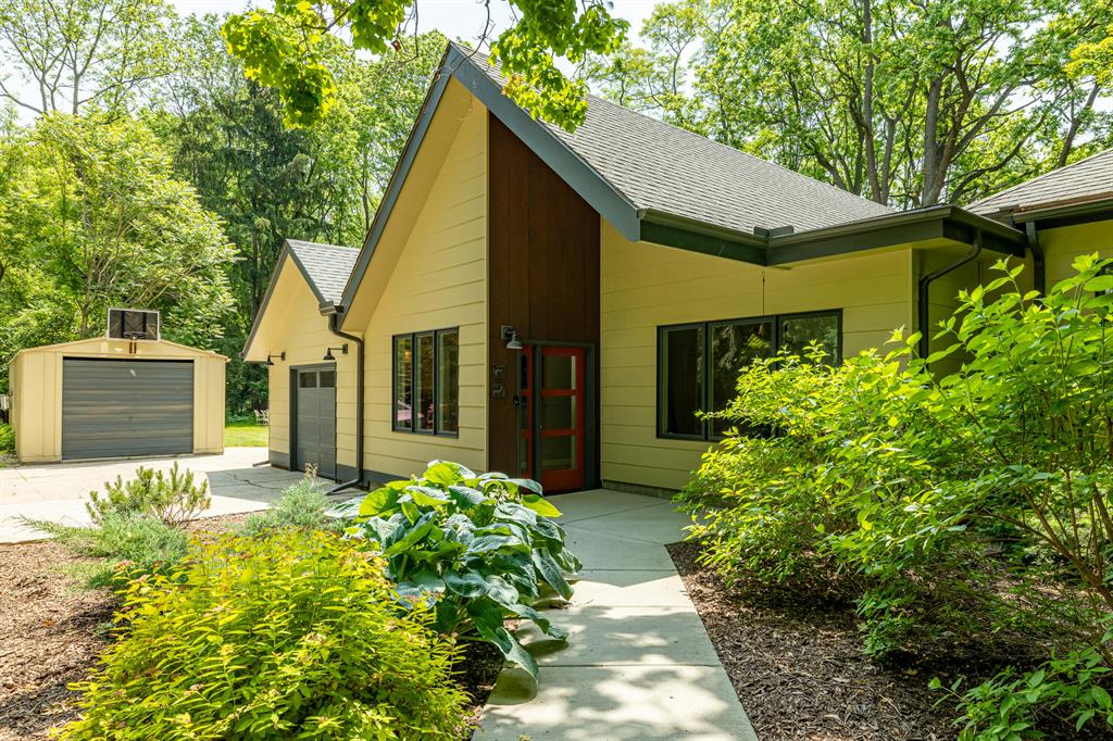 Unique opportunity to own a private 2-acre sanctuary right in the heart of Ann Arbor! This beautiful, wooded lot in the desired Northside neighborhood can be split and is zoned R1D, which allows up to 16 units on 2 acres - a prime development opportunity for a small builder/developer. Or keep this newly remodeled retreat all to yourself with 2475 SF of light-filled spaces overlooking a lush, landscaped yard through large windows. Open-concept modern spaces, including a double-story great room with polished concrete floors, built-in shelving, a loft, a wood stove, and access to a backyard deck, flow seamlessly into the dining area with picture windows overlooking the spacious, private yard. The brand-new kitchen has custom-built shaker cherry cabinets, honed granite counters, a large island, and newer stainless steel appliances. New maple wood floors in kitchen and dining area that extend into the rest of the main floor bedrooms. The Main floor contains 3 bedrooms, 2 full baths, and an office. The primary bedroom is exquisite with an en-suite, fully remodeled bathroom with soaking tub and custom-built vanity, picture windows, a fireplace, and a patio door that leads to your own private porch with an expansive view of the yard. The lot is fully fenced with a mix of mature shade trees and open lawn space with two bonfire pits, a garden, and a custom-built chicken coop - a perfect private "playground" for any family.
The lower level boasts a family room w/built-ins and a 4th bedroom and laundry room with space for a third bath, and plenty of closets and storage space. 2016 Boiler w/ 95% efficiency. Radiant floor heat throughout main floor. All new windows. See attached list of improvements. Attached 2-car garage is over 1000 sq.ft. with ample workshop or hobby space, w/220A service. Detached 1.5-car garage also on site. On bus line to Downtown Ann Arbor and Plymouth Road. Close to Leslie Park, Huron River, U-M North Campus and Michigan Medicine Hospital and Kellogg Eye Center, and STEAM School. Home Energy Score of 6