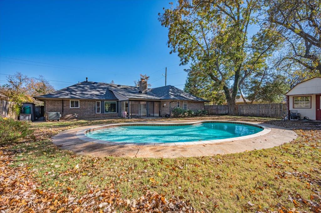 Open House Sunday Nov 23rd 2-4pmFresh exterior updates and strong potential in a highly desirable Norman location. This 3-bed, 2.5-bath home features a new Class 4 impact-resistant roof, new gutters, and fresh exterior paint. Inside offers two large living areas, a bright sunroom overlooking the inground pool, and a kitchen with a breakfast nook, walk-in pantry, and ample storage. A powered detached workshop and circle drive add extra convenience. Seller will provide up to $5,000 towards improvements. Currently priced under tax valuation! Great opportunity to add value while customizing to your style—schedule your showing today!