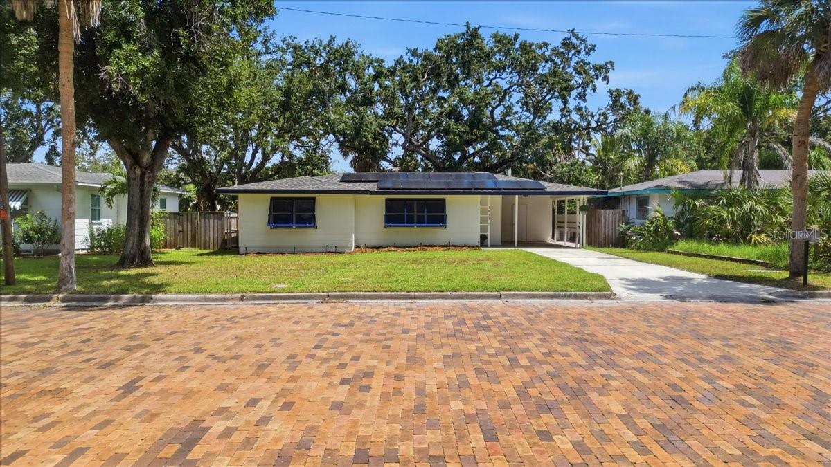Virtually Staged. Imagine stepping out of your backyard directly onto the Pinellas Trail. Welcome home to a beautifully renovated home that meets the laid-back Dunedin lifestyle! Located on a charming brick-lined street in desirable Dunedin Isles, this move-in-ready 3-bedroom home puts you just minutes from Downtown Dunedin(5 minutes), the waterfront, local breweries, restaurants, boutiques, parks, Honeymoon Island State Park(13 minutes), and some of the Gulf Coast’s most beautiful beaches. Inside, the home feels bright, fresh, and completely updated. The renovated kitchen features granite countertops, new appliances, a convection gas oven, new cabinetry, and an additional built-in counter with extra storage—perfect for everyday meals, entertaining, or creating your own coffee or beverage station. New luxury vinyl flooring, modern fixtures, and a beautifully updated bathroom with a tiled tub/shower surround complete the clean, contemporary interior. Beyond the finishes, buyers will appreciate the extensive improvements already completed including a 2022 ROOF, 2024 HVAC, 2025 WATER HEATER, assumable SOLAR PANELS installed in 2022, and HURRICANE-IMPACT WINDOWS throughout most of the home, with shutters for the remaining windows. Outside, the approximately 7,500-square-foot lot offers plenty of room to enjoy Florida living. The fully fenced backyard creates a private outdoor setting beneath the shade of a mature oak tree, along with a storage shed, carport, and utility area ideal for bikes, beach equipment, paddle boards, and more. Whether you’re heading downtown for dinner, spending the day along the Gulf, or simply enjoying a quiet afternoon at home, this beautifully renovated residence puts the best of Dunedin within easy reach. Thoughtfully updated, move-in ready, and ideally located, this property offers the perfect blend of comfort, convenience, and the Florida lifestyle. Schedule your private showing today and experience it for yourself!